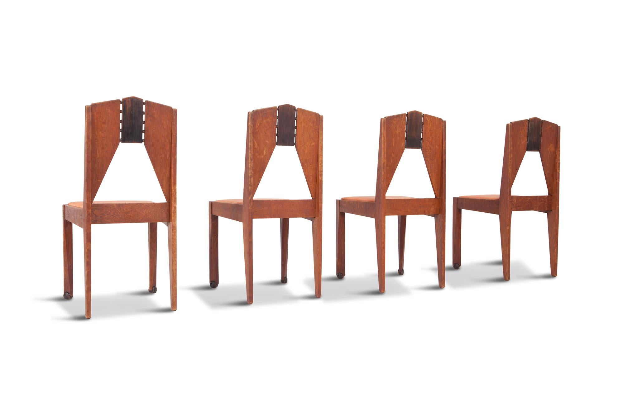 Oak dining chairs in a rare skin velvet upholstery by the Amsterdam School.

Amazing woodwork showing true craftsmanship, the detailing gives these chairs a very modern appearance. Truly exceptional for their age. 

The Netherlands, 1930s.
   