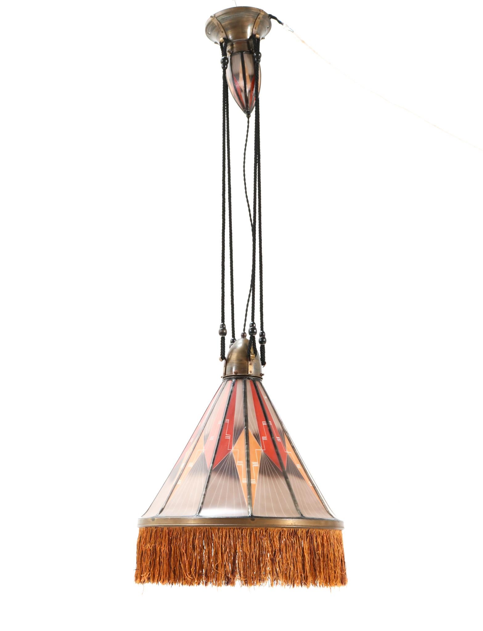 Magnificent and ultra rare Art Deco Amsterdamse School chandelier.
Design by Hendrik Cornelis Herens for De Nieuwe Honsel.
Striking Dutch design from the 1920s.
Model D223 and ultra rare because of the decorations in the stained glass!
Original