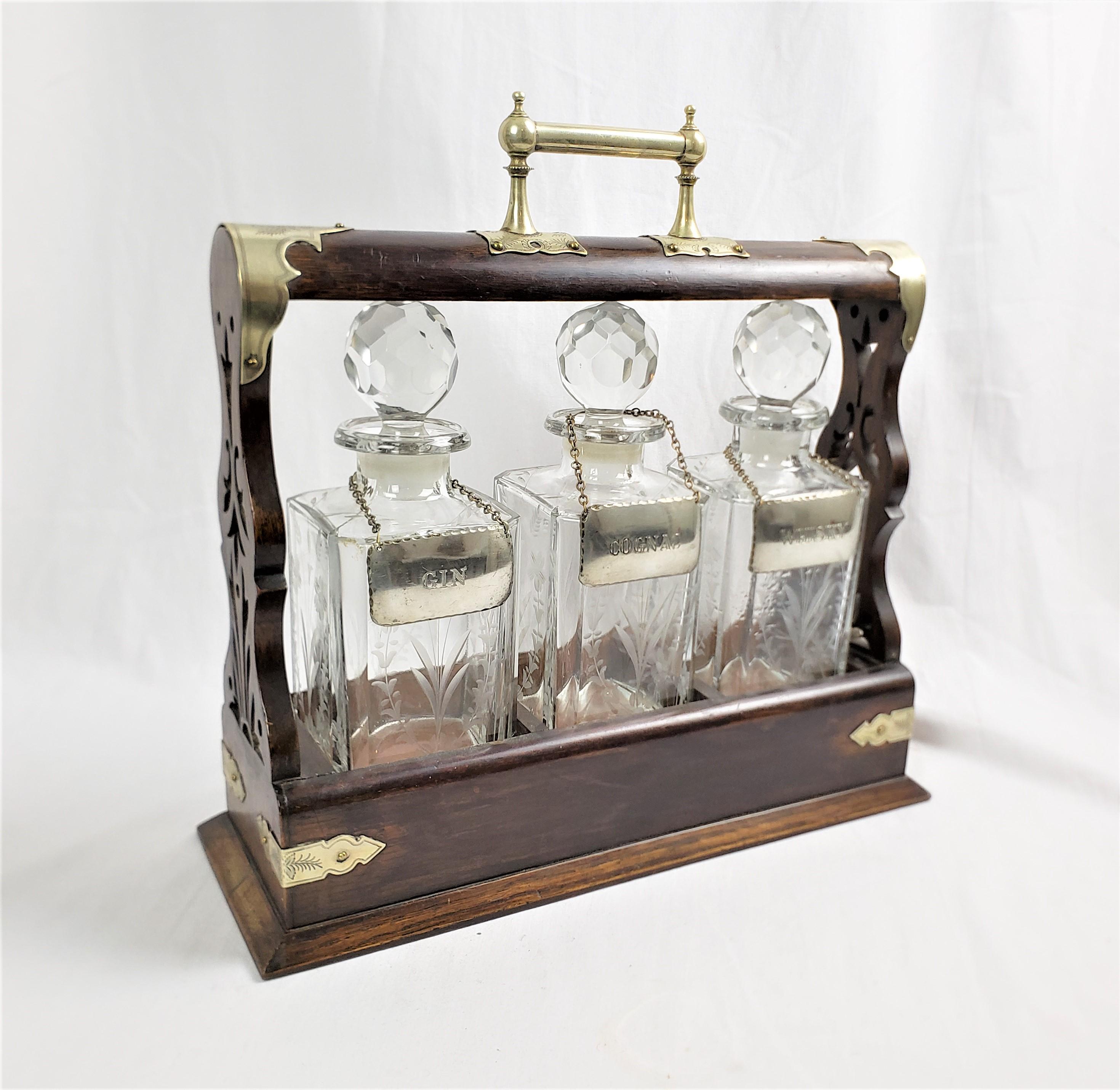 Edwardian Antique English Three Bottle Oak Tantalus with Etched Floral & Engraved Accents For Sale