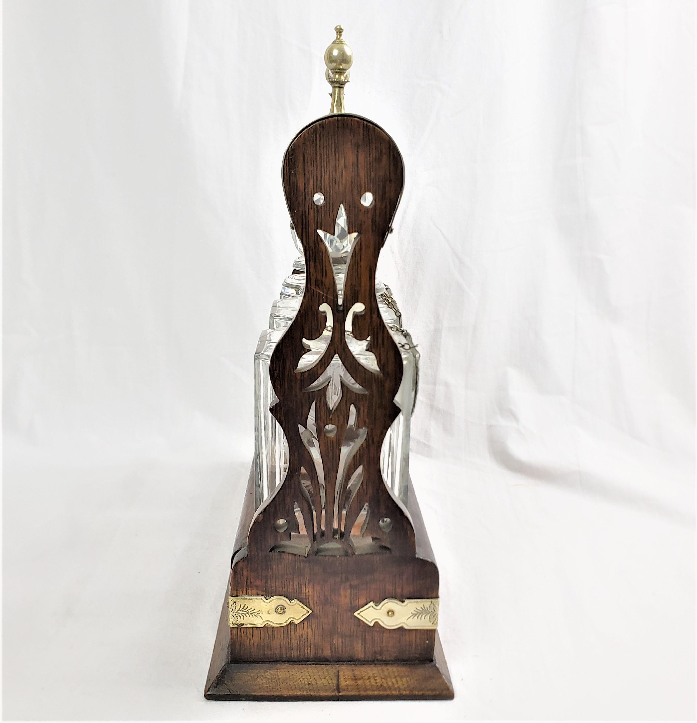 Antique English Three Bottle Oak Tantalus with Etched Floral & Engraved Accents In Good Condition For Sale In Hamilton, Ontario