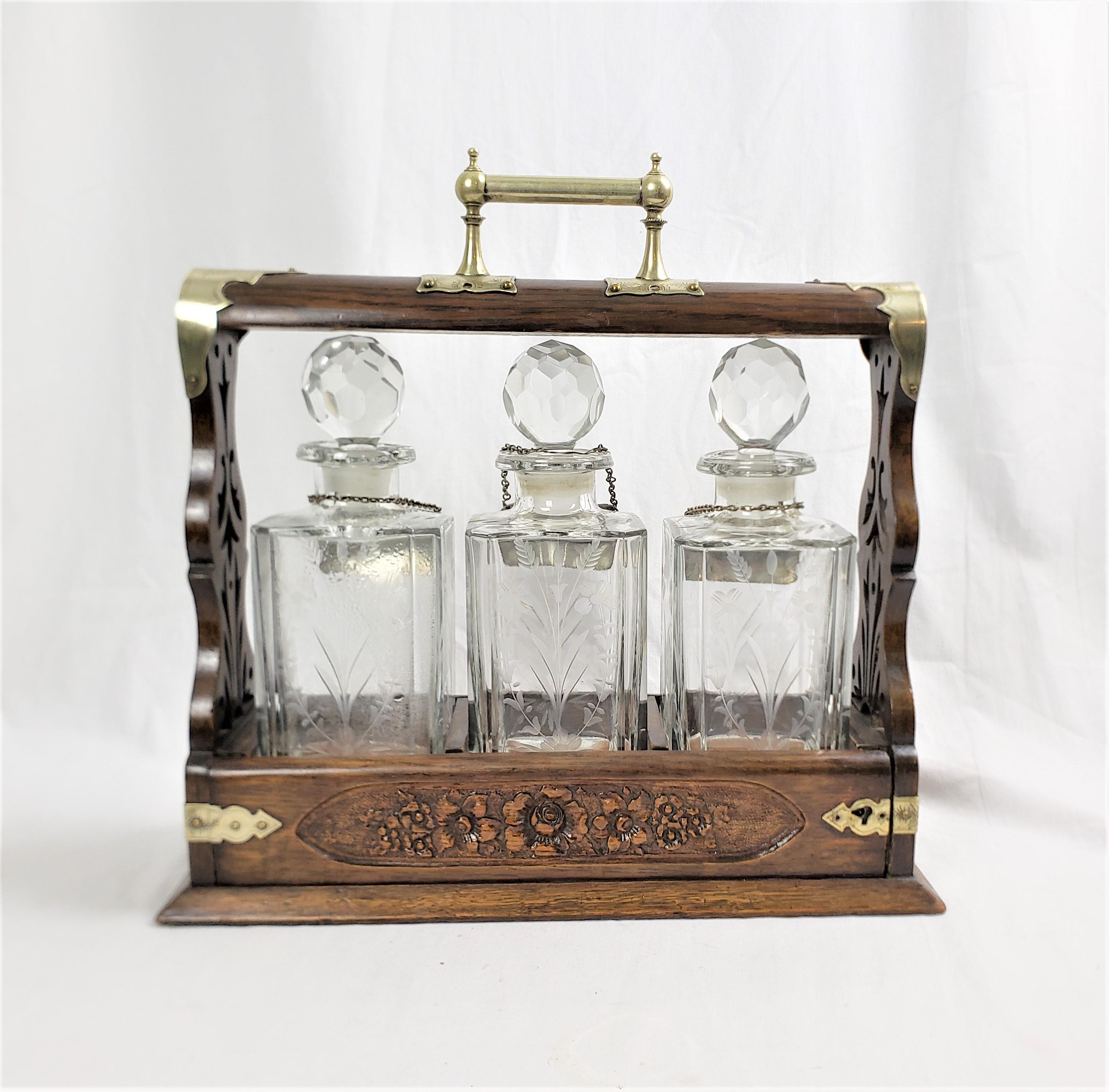 19th Century Antique English Three Bottle Oak Tantalus with Etched Floral & Engraved Accents For Sale