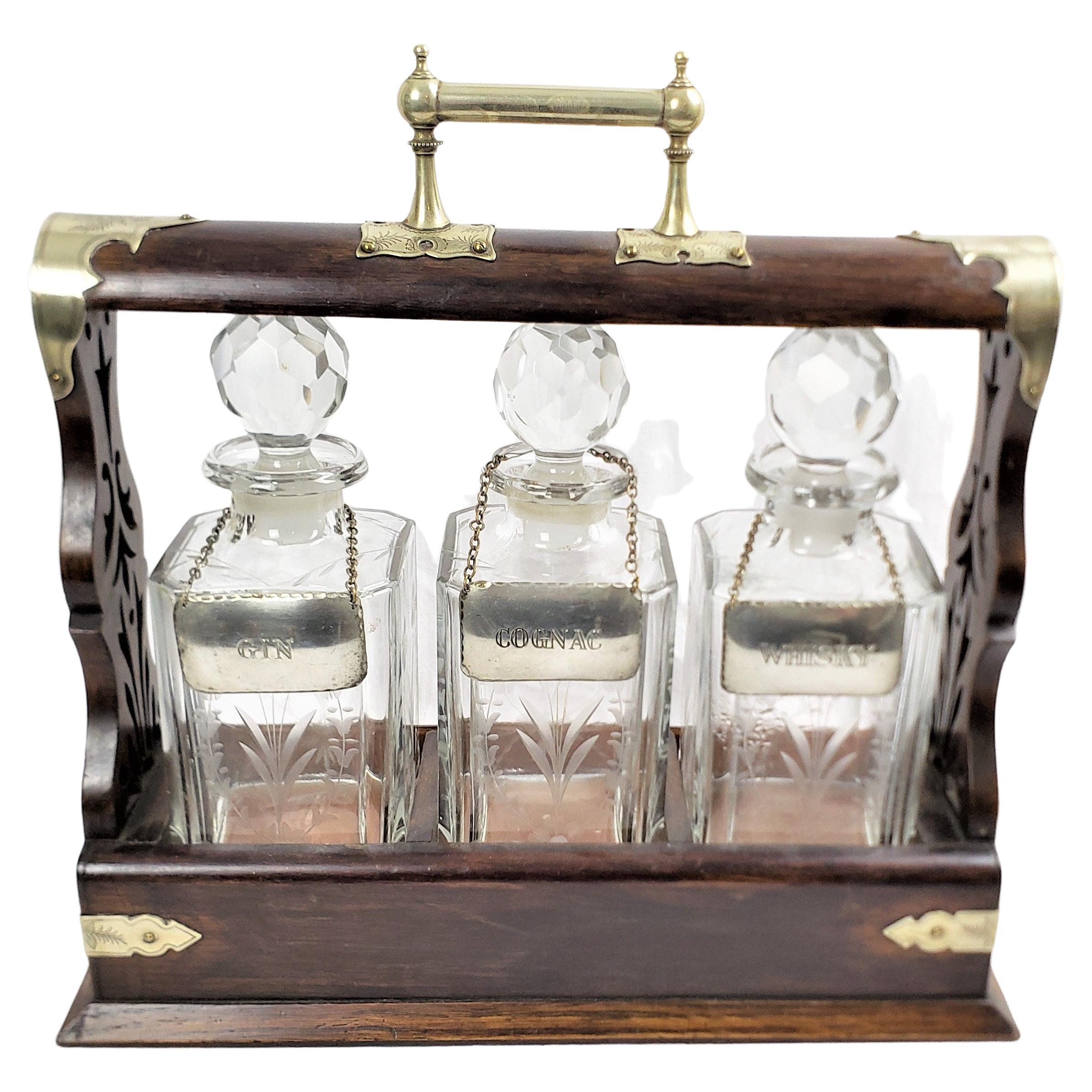 Antique English Three Bottle Oak Tantalus with Etched Floral & Engraved Accents For Sale
