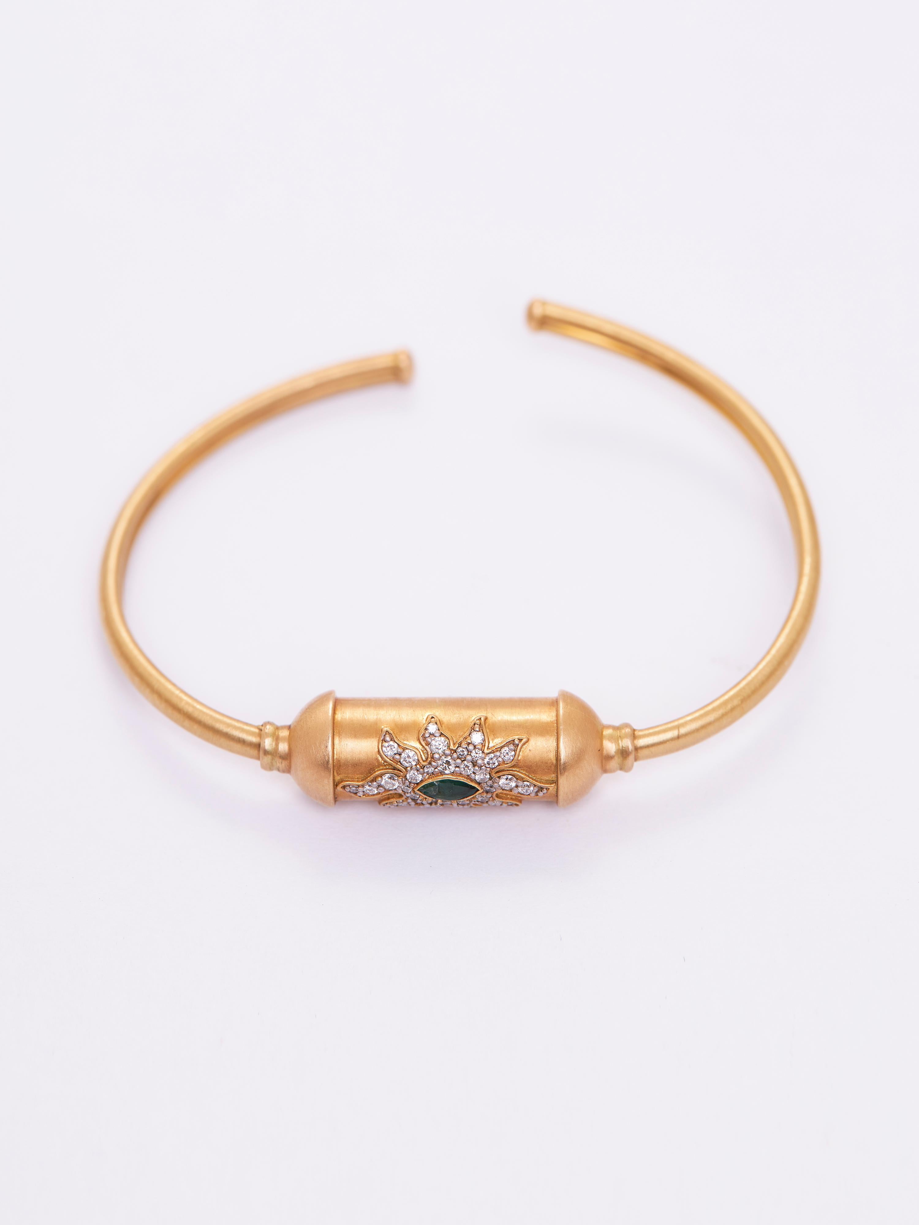 The Amulet Container Bracelet is a beautifully crafted three-dimensional amulet container bracelet, designed to protect and enhance the potency of the sacred messages it encases. Weighing 13.495 grams, this piece is fashioned in 18KT gold (13.606