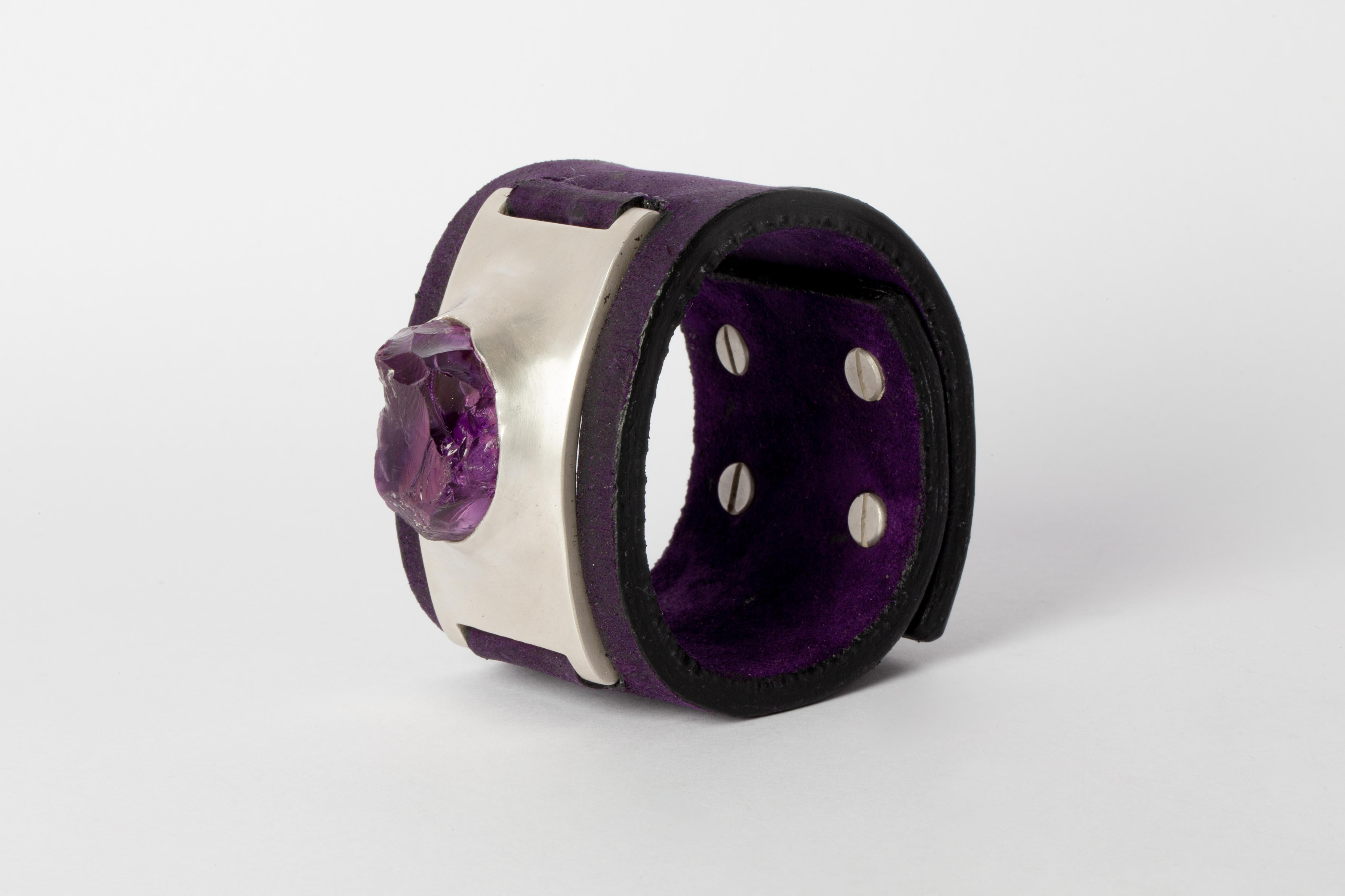 Bracelet in brass, amethyst, and purple anemone leather. Brass substrate is electroplated with silver and then dipped into acid to create the subtly destroyed surface. This item is made with a naturally occurring element and will vary from the