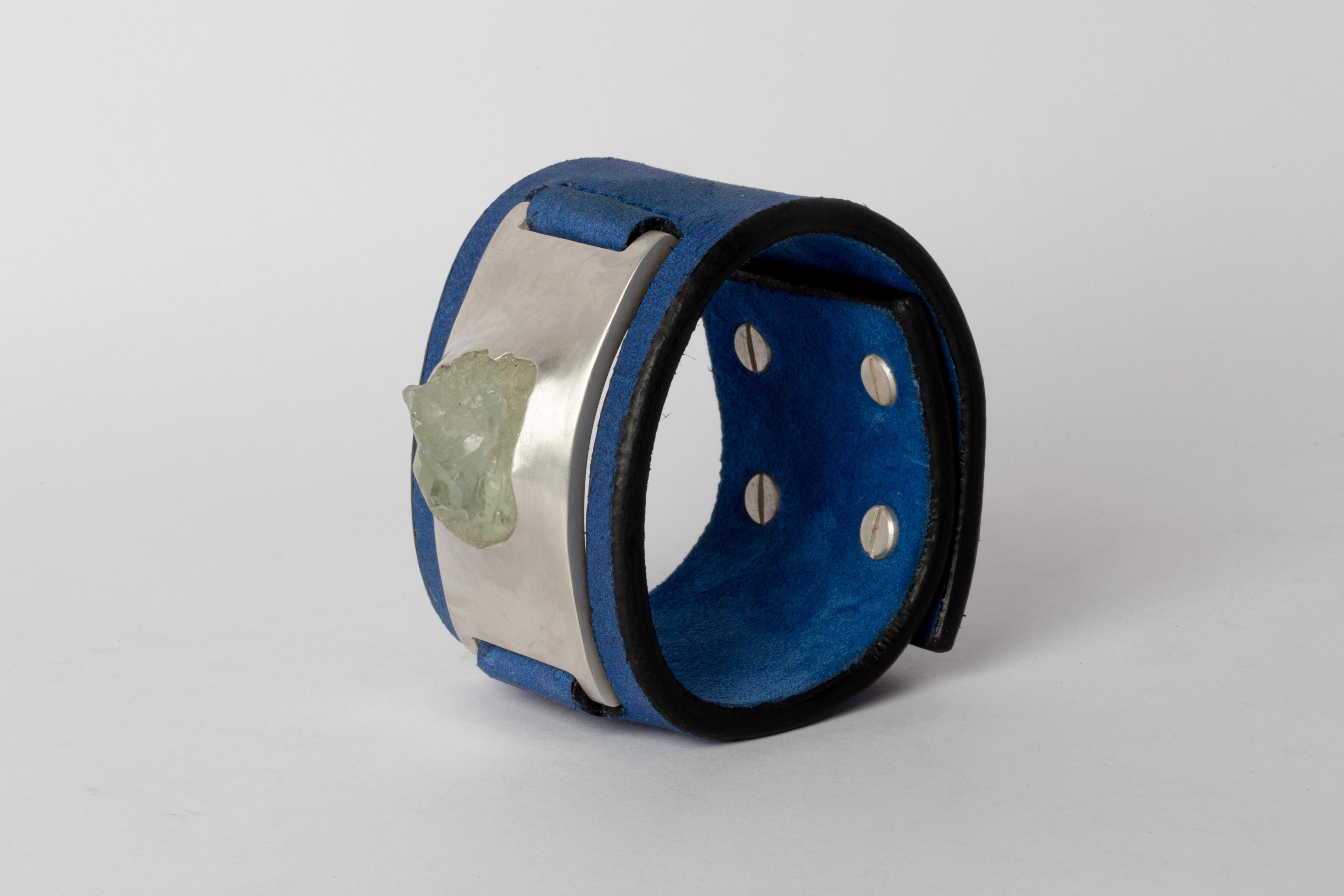 Bracelet in acid treated silver plated brass, aquamarine, and blue kudu waxy leather. This item is made with a naturally occurring element and will vary from the photograph you see. Each piece is unique and this is what makes it special.
