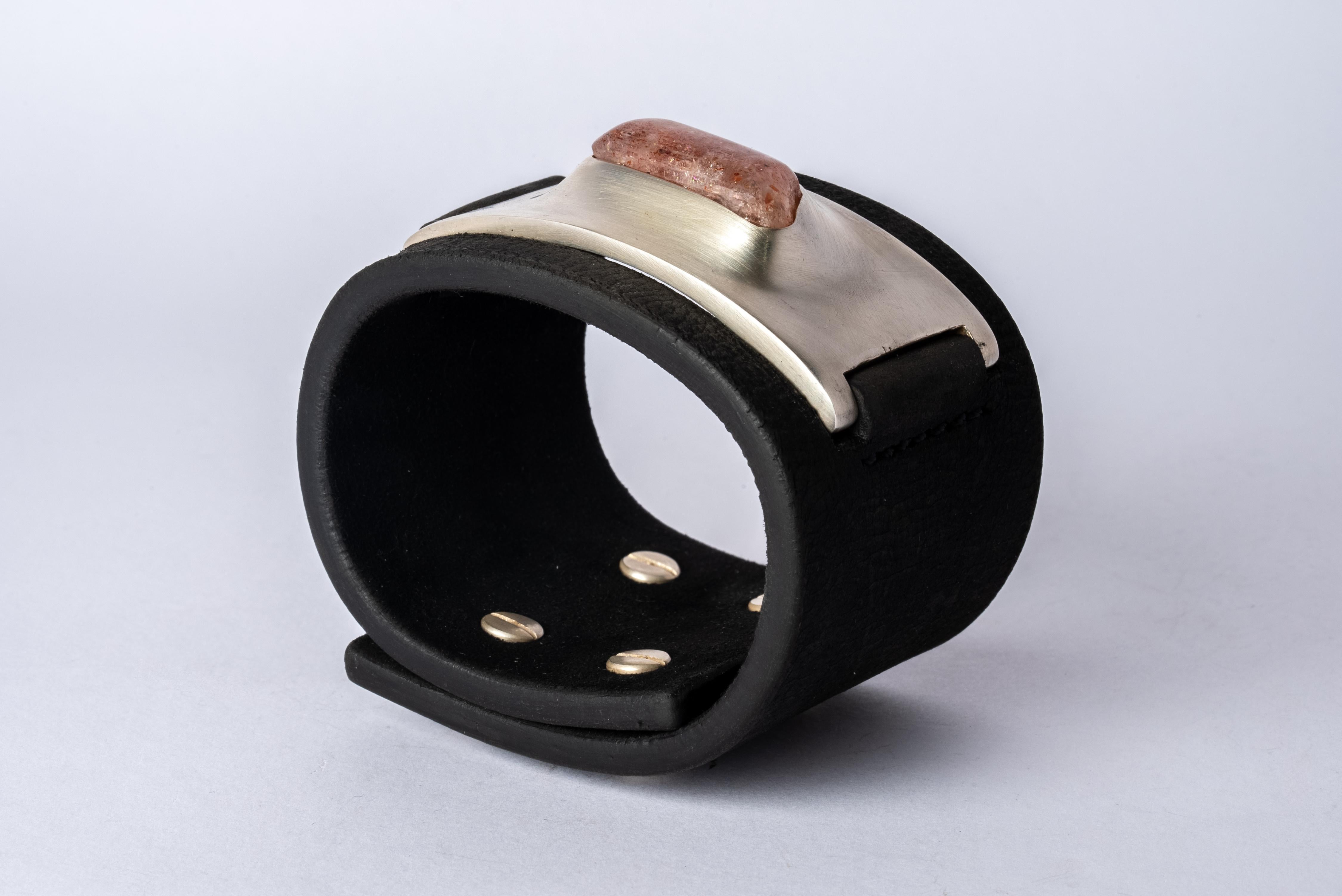 Bracelet in brass, sunstone. and black kudu waxy leather. This item is made with a naturally occurring element and will vary from the photograph you see. Each piece is unique and this is what makes it special.
Bracelet band width: 50 mm