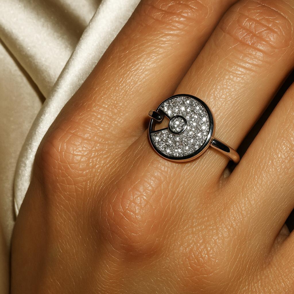 A dance of elegance and protection.

From Cartier’s coveted Amulette collection, this 2020 design transforms the classic talisman into a beacon of light. Crafted in 18k white gold, the ring centers a brilliant-cut diamond suspended within a