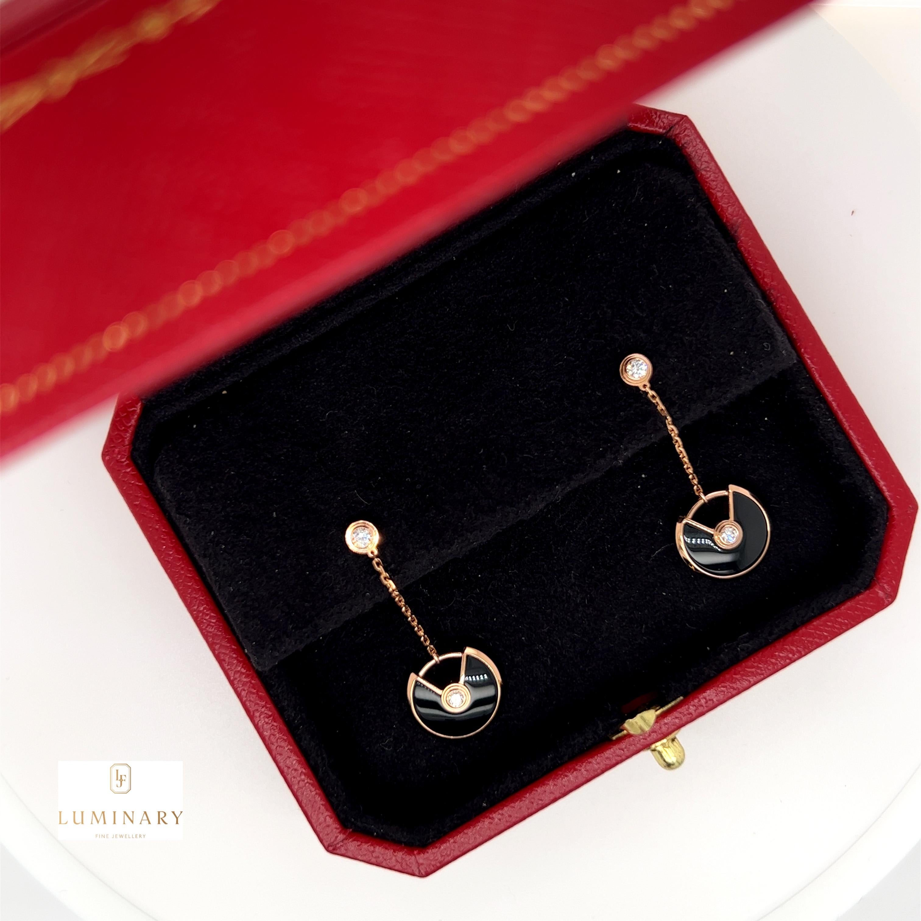 Amulette de Cartier earrings, XS model, 18ct rose gold, onyx, set with 4 brilliant-cut diamonds totalling 0.14 carats. 

Cartier's Amulette de Cartier collection is enchanting, its good luck pieces are a symbol of countless good wishes, which each