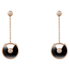 Boucles d'oreilles Amulette de Cartier modèle XS, en or rose, onyx et diamants