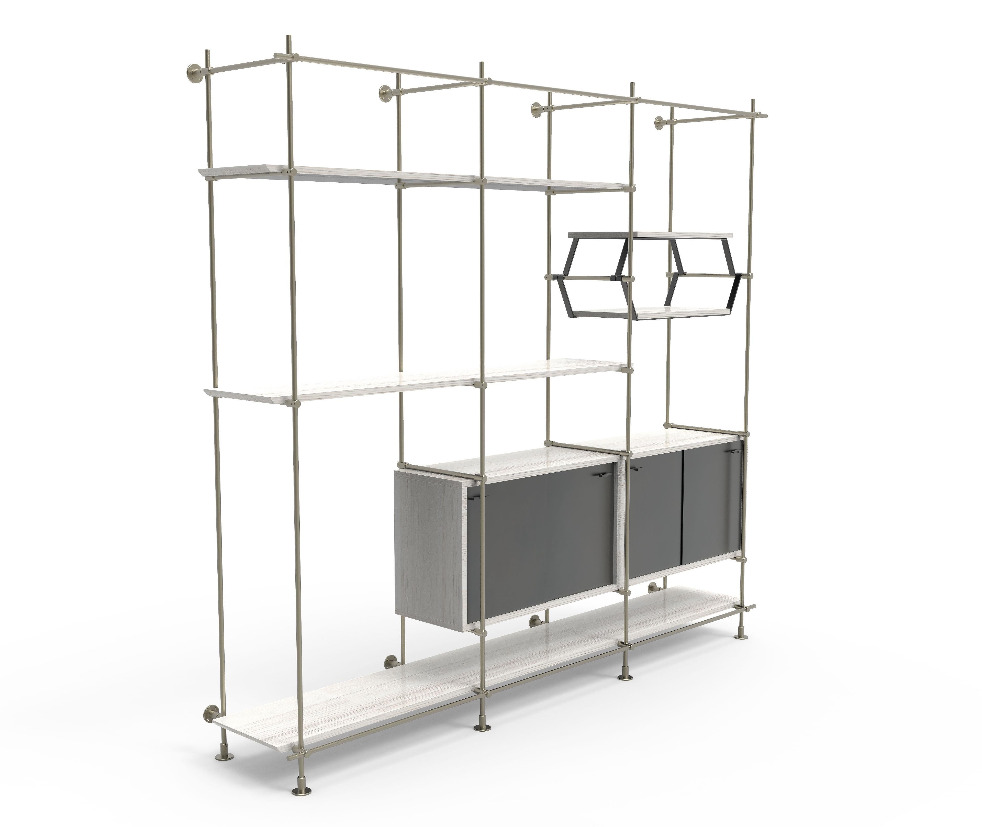 This 3 bay version of Amuneal’s Collector’s shelving unit features solid machined brass fittings and posts in a champagne brass finish. The unit mounts to the floor and to the wall to support a series of shelves and credenza cabinets. The wood