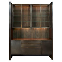 Amuneal's Blackened Stainless Steel + Oak Bar with Floating Glass Cabinets