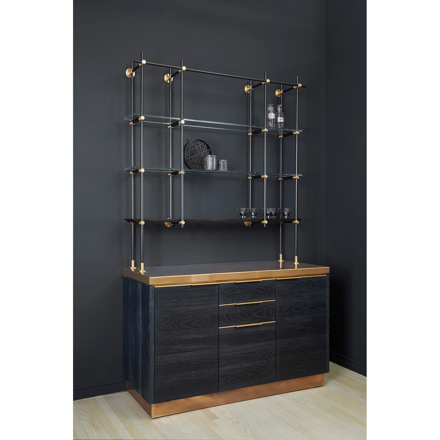 Amuneal's Charred Pine Bar Cabinet with Brass Countertop is a one of a kind textural statement piece. The patinaed and polished countertop and hardware contrasts the charred pine door and drawer faces that have been wired-bushed and burnt using the