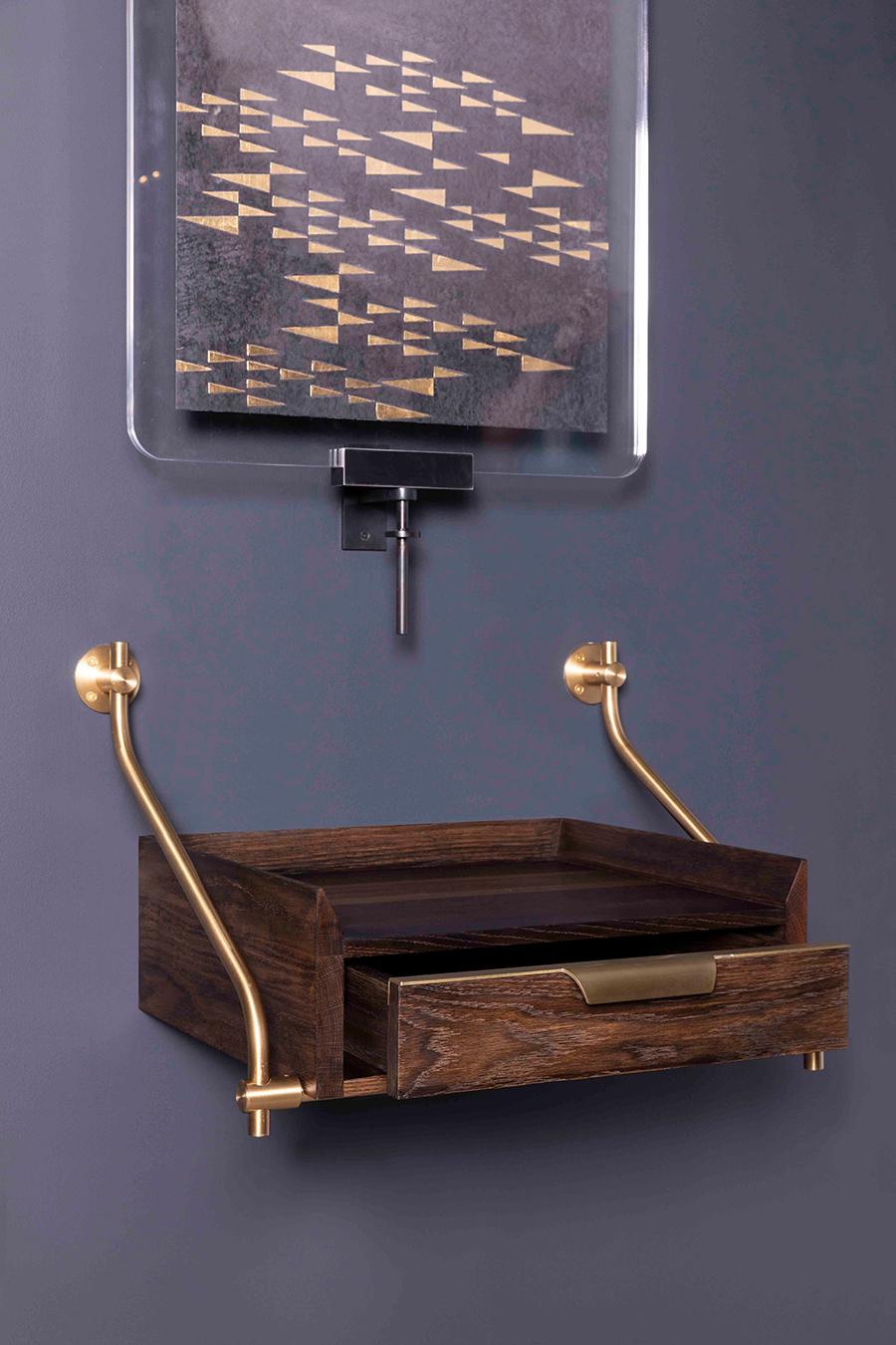 Amuneal’s wall hanging oxidized oak console table uses our traditional Collector’s Shelving hardware to support this one-drawer unit with raised knife-edge surround. The scale of the unit and its unique floating design make it a great entry table,