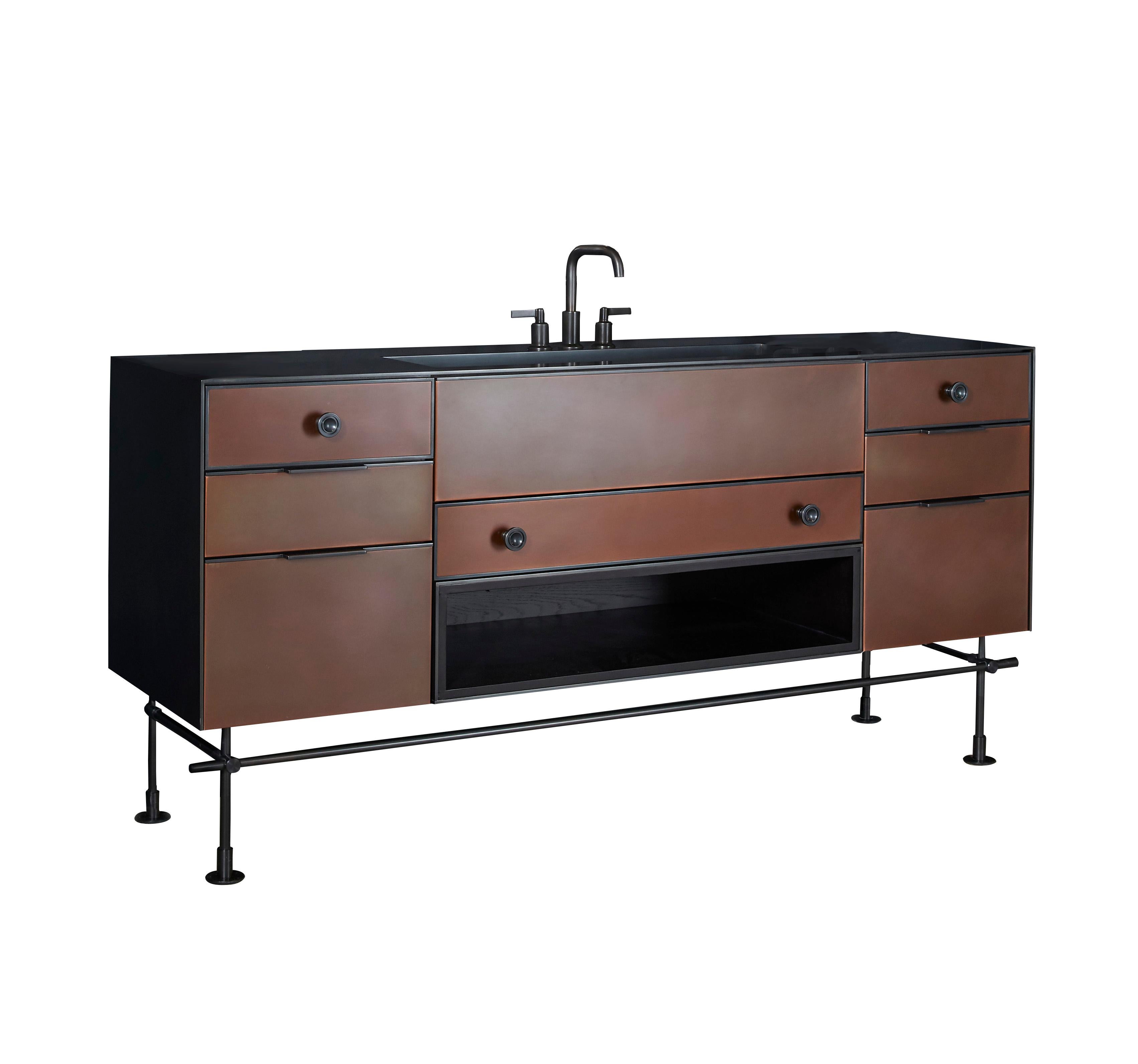This copper and stainless steel vanity with integral sink is ideal for a bathroom or powder room.  The patinaed copper finish is warm and worn, almost leather like, while the stainless steel surround is textured and high craft.  All hardware is