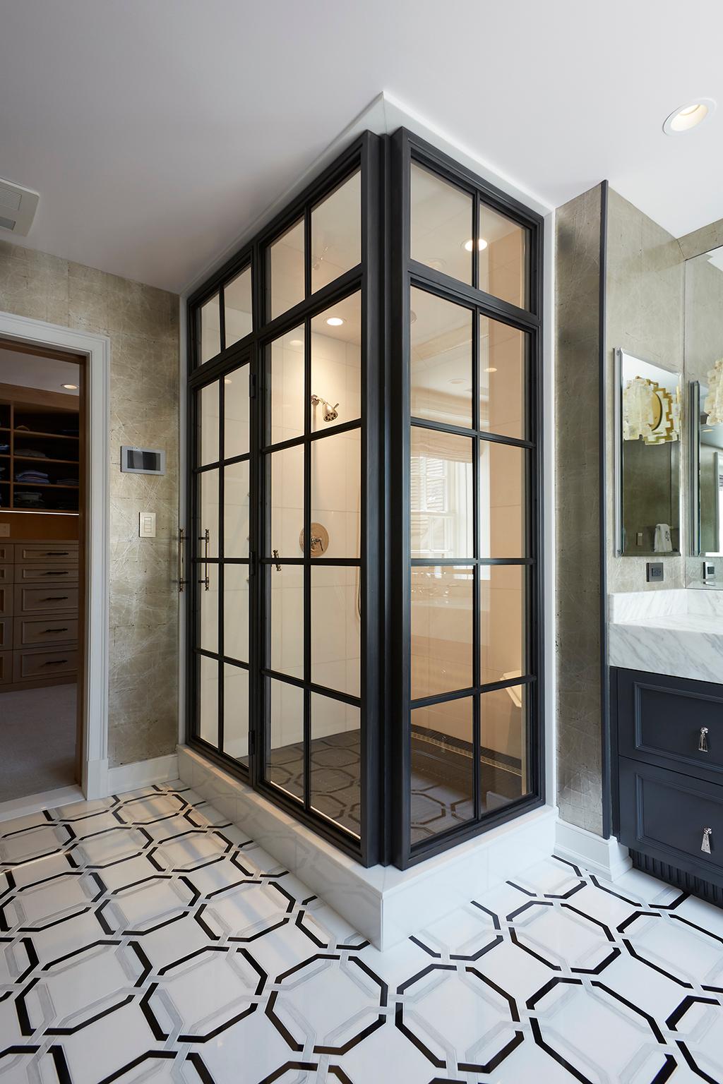 Inspired by vintage factory windows and our Frankford Panel System, this industrial custom shower enclosure includes operable transom and custom machined bronze door pulls.

The base material is stainless steel to eliminate the possibility of