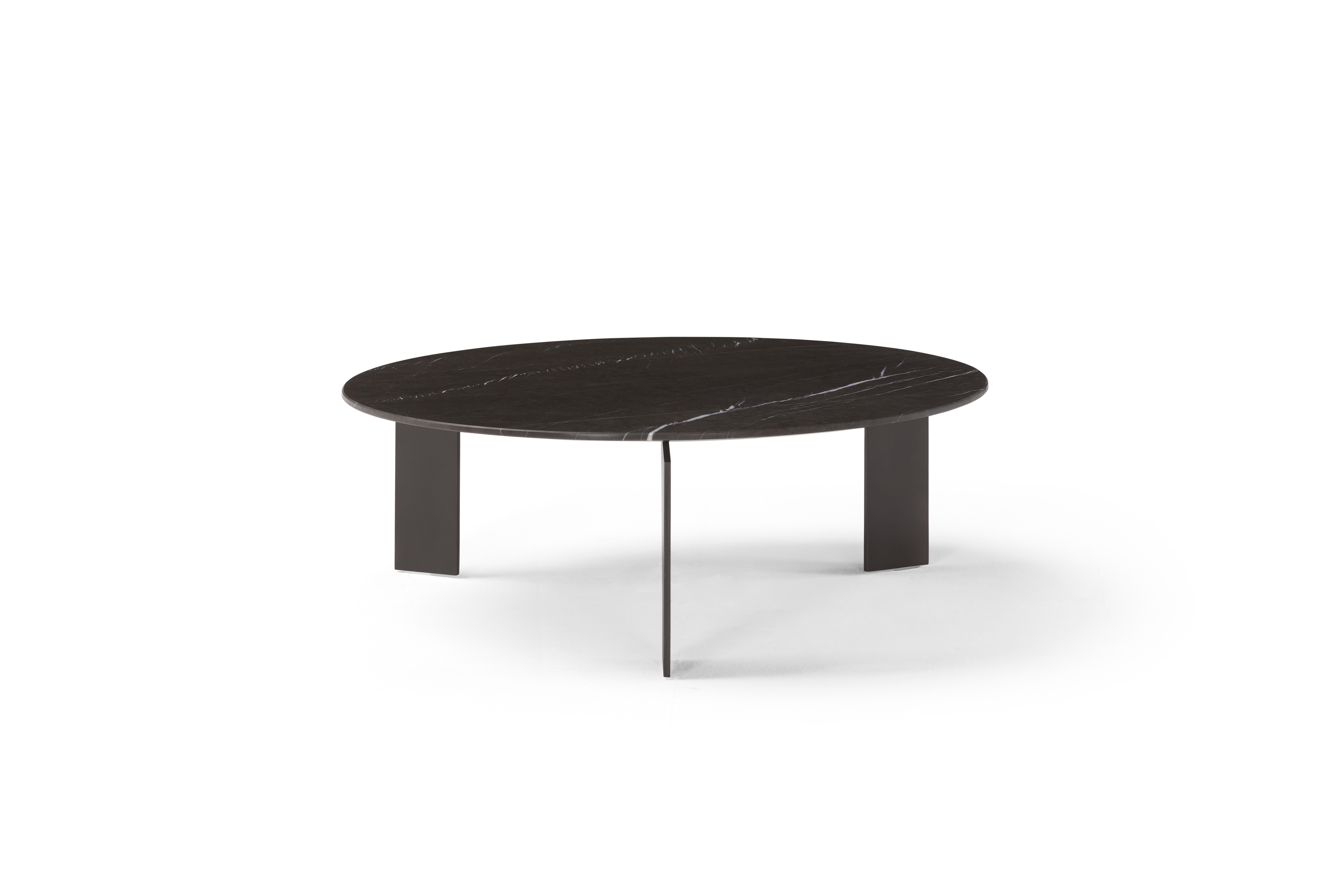 Range is a coffee table collection that combines materials: metal and marble or wood and is inspired by finding the right balance between design and function. Available in four sizes (with different height and diameter of the top), the Range tables