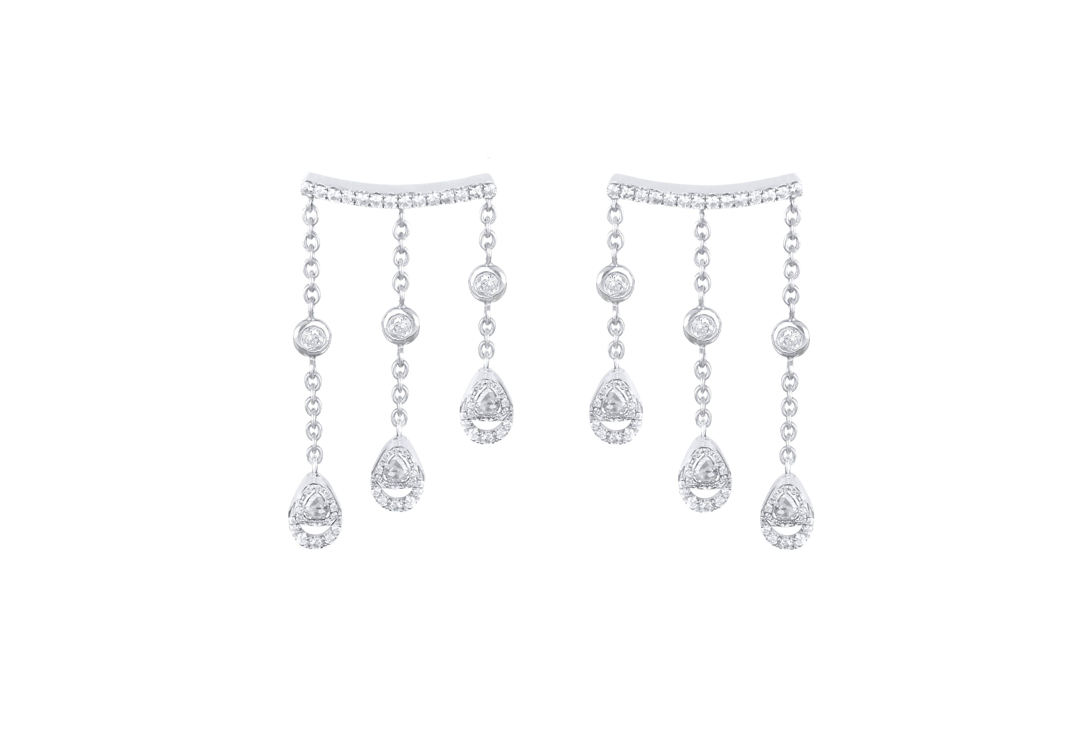 Captivating compositions of rose cut and round diamonds are set at eye-catching angles in Amwaj white gold earrings with 3 drops diamonds. A contemporary interpretation of the classic drop earring crafted in 18 karat white gold, three strands of