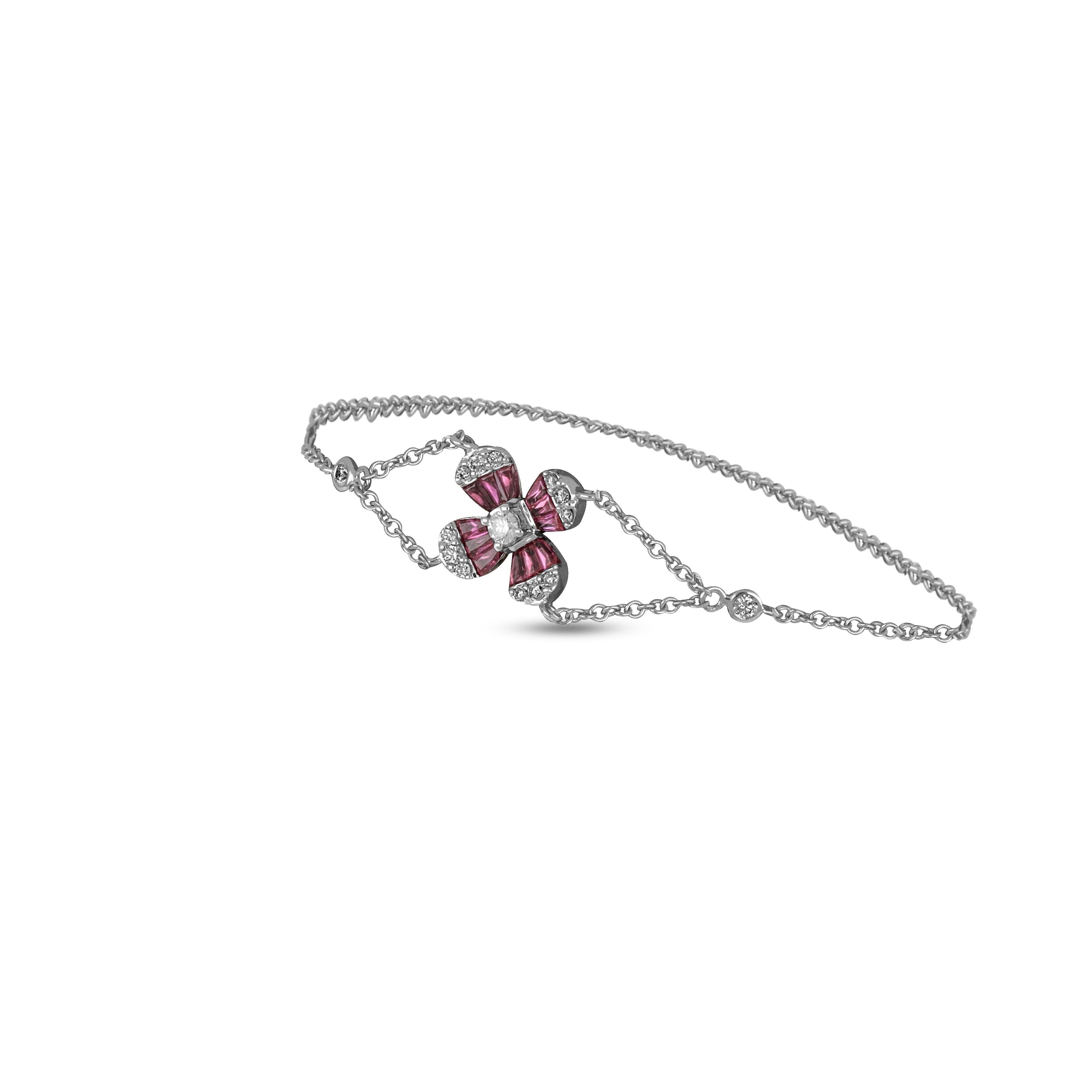 This elegant 18 karat white gold flower bracelet offers subtle sparkle for every occasion. Rubies are set to form the four sides of the flower, accompanied by outer small round cut diamonds. 
18 Karat White Gold 
Diamond (Total Carat Weight: 0.32