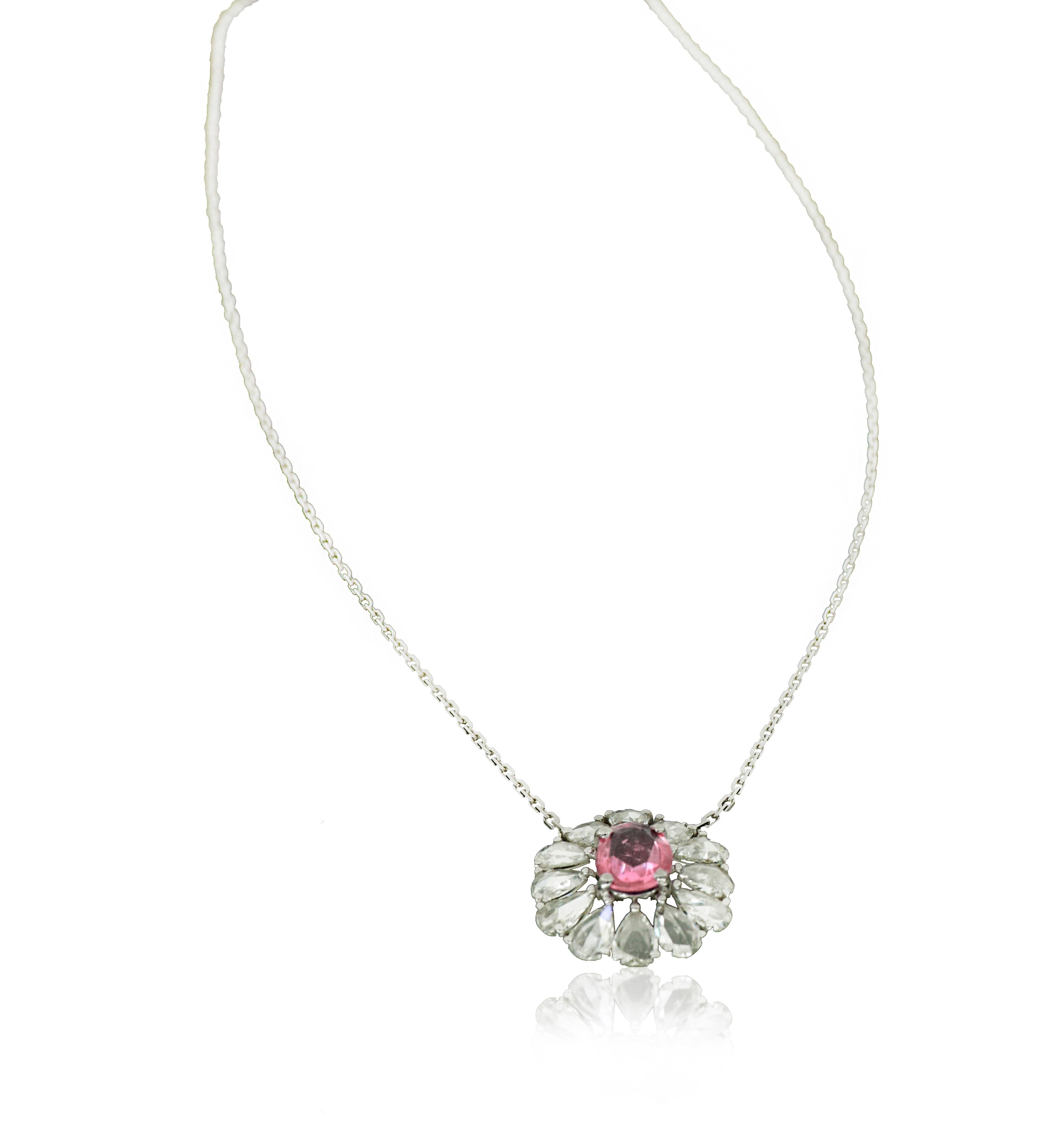 Charming, floral 18K White Gold Pendant by Amwaj Jewelry with pear shape rose cut Diamonds ,delicately set with pink sapphire to make a perfect assemble for this Pendant . It makes an illusion of flower and replicate nature’s ephemeral beauty in