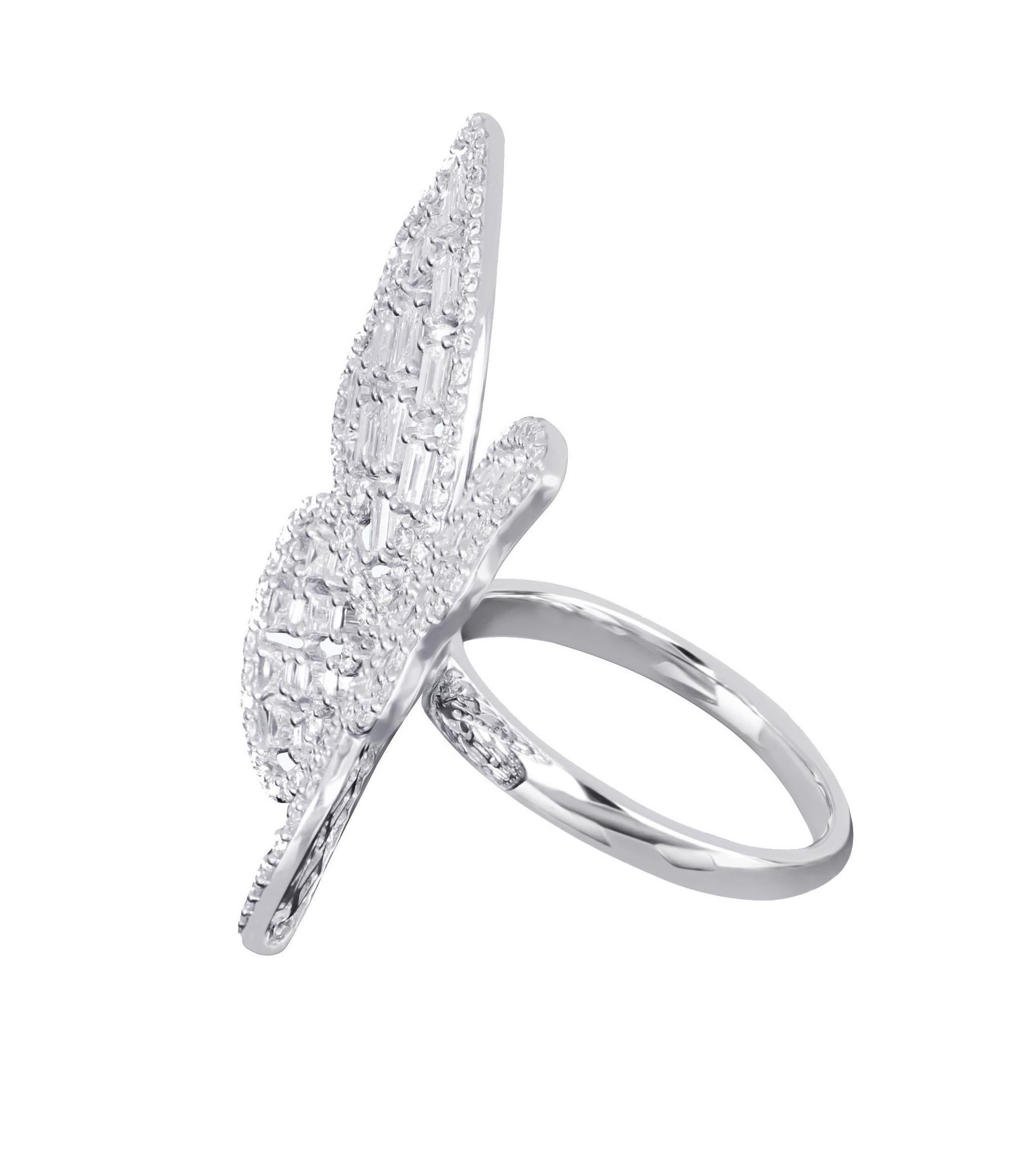 Amwaj butterfly ring in 18 karat white gold features multi layers of butterfly wings illuminated with baguette and round diamonds that presents an elegant design for every day, round diamonds trace the outline of this mesmerizing creature, with the