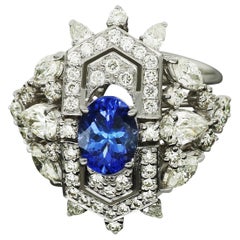 Anillo de diamantes talla marquesa y redonda con tanzanita de Amwaj Jewellery