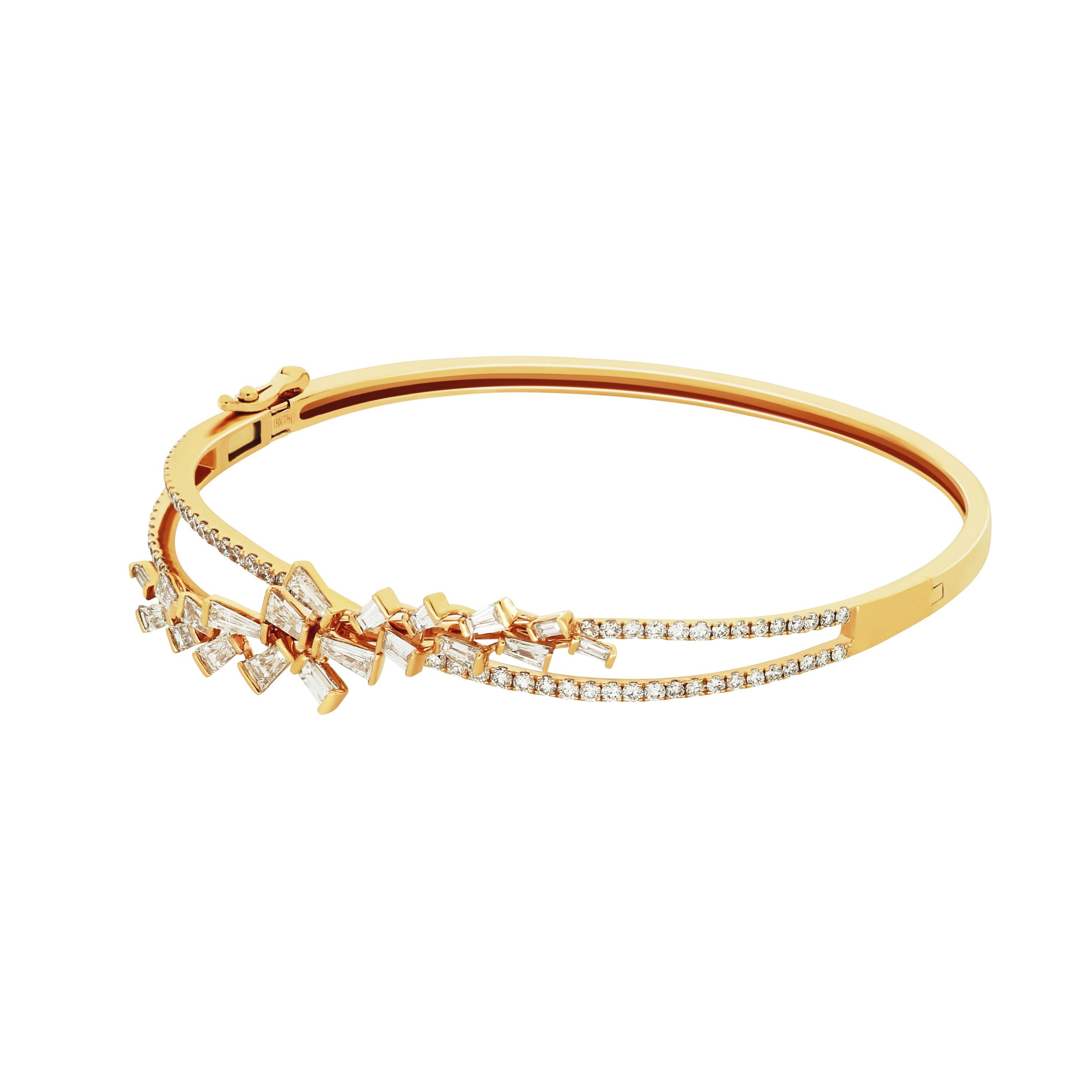 An eye-catching 18 karat rose gold bangle by Amwaj Jewellery that showcases the impeccable beauty of marquise shape diamonds, set within a minimal metal setting to allow their powerful radiance to emanate.
Diamonds (Total Carat Weight: 1.8 ct) 
18