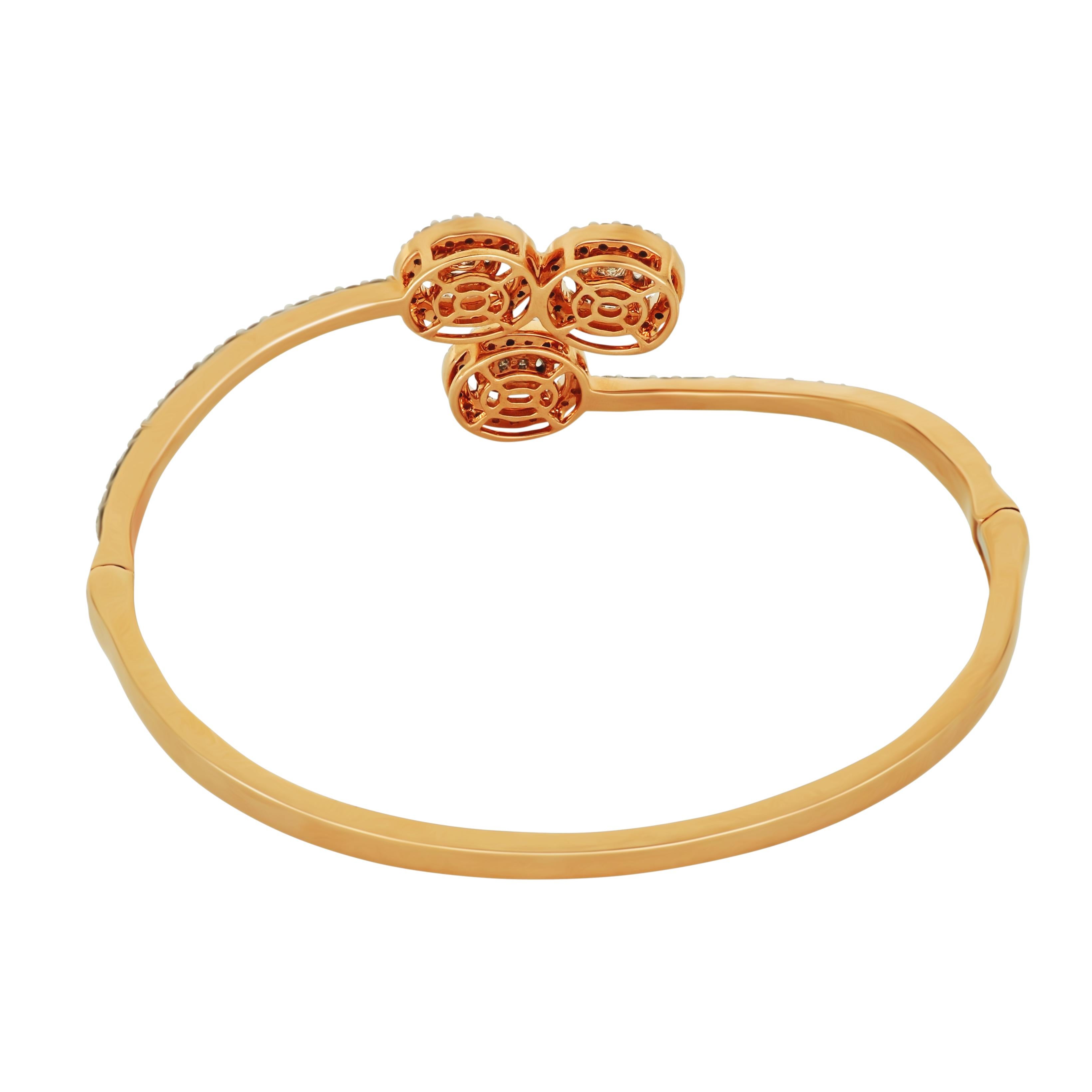 The creative setting of this romantic rose gold bangle leads the eye to the beautifully 3 center round cut diamonds set at opposing angles, surrounded by a halo of small diamond and complemented by magnificent baguette and round white
