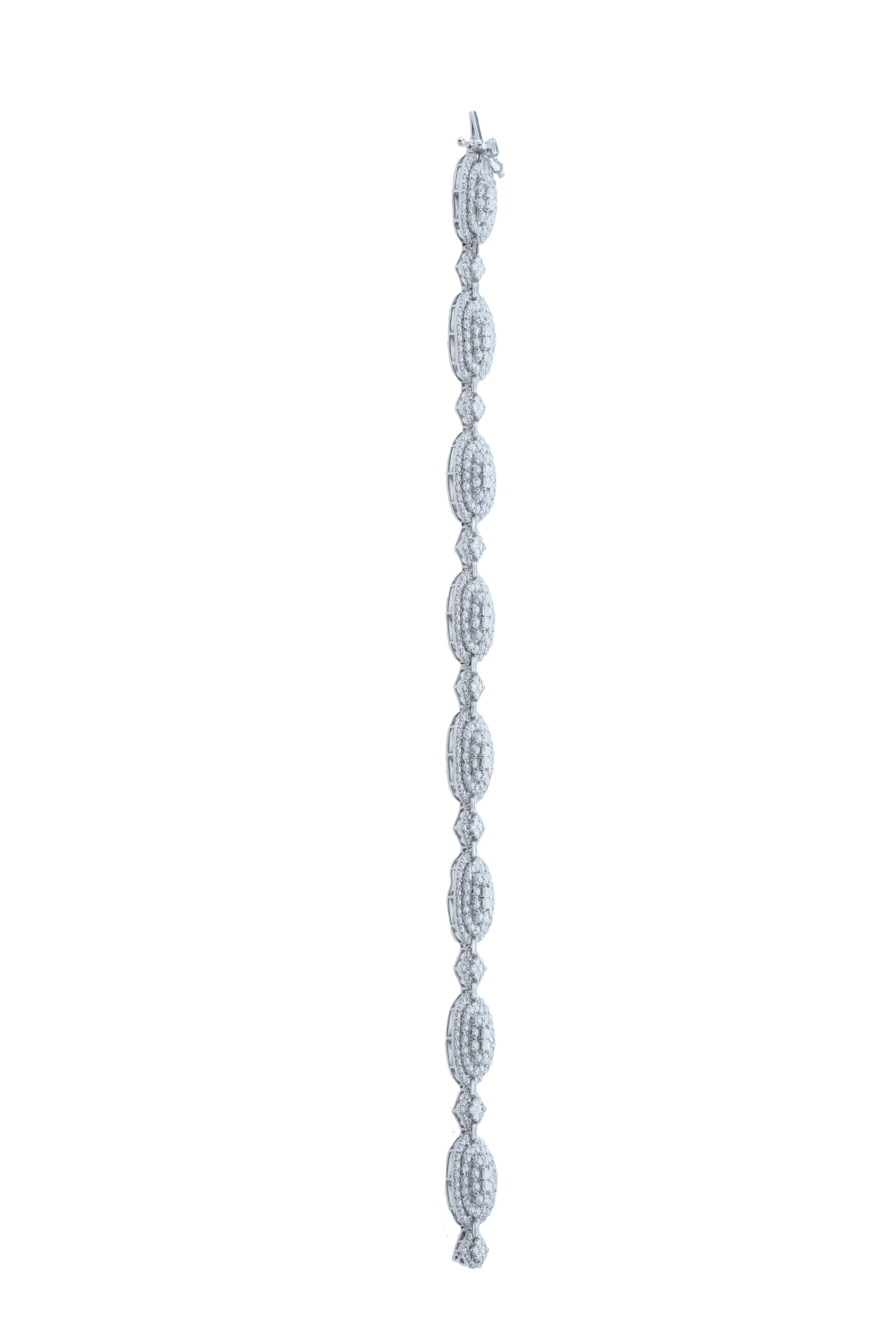 A Cascade of Diamonds, this white diamond bracelet carries an inspirational design , featuring round solitaires that is surrounded by mesmerizing round diamonds. 
	
Diamond Clarity:  SI / G H COLOR
Diamonds (Total Carat Weight: 10.63 ct) 
18 Karat