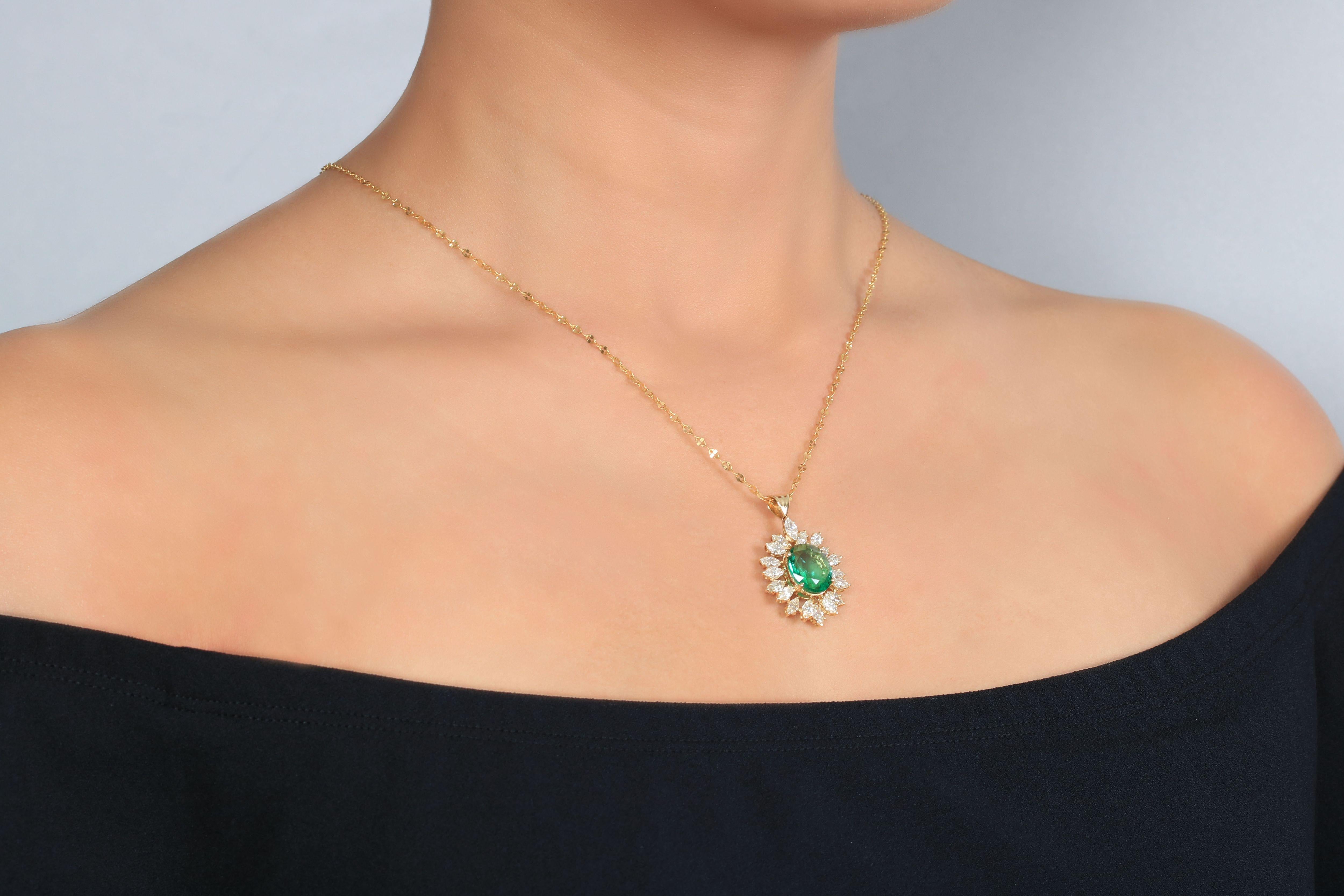 A Golden Glow, this oval cut Zambian emerald with marquise cut diamonds necklace creates a sense of delight mixed with this artistic combination of precious stones. Although it's a classic emerald jewelry, it holds the appeal of a modern