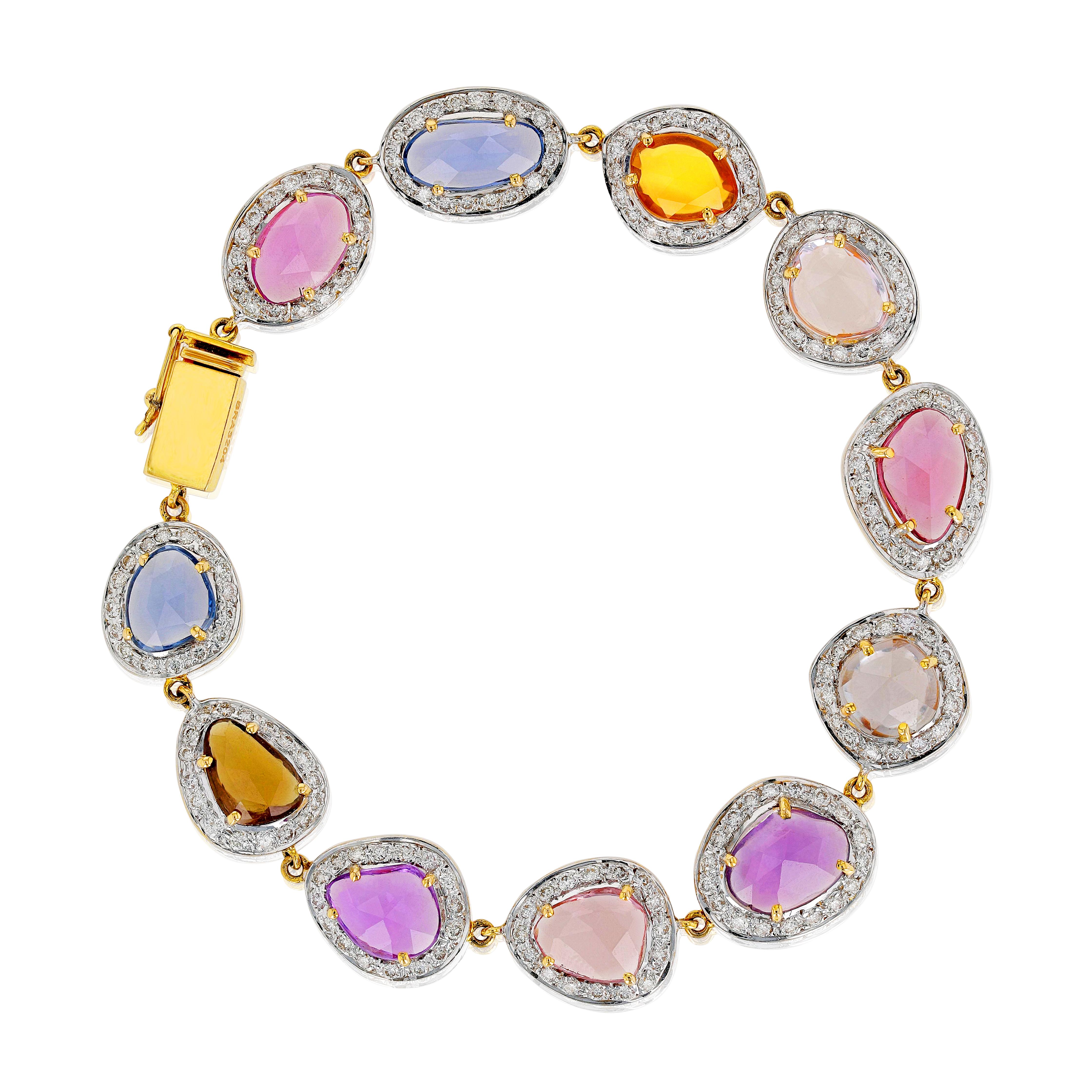 A timeless bracelet comprising multi-color sapphires, matched with small round cut white diamonds weighing 2.21 carats. The design of this white gold bracelet makes it a classic bracelet to treasure. Each sapphire is selected for its rich hue,