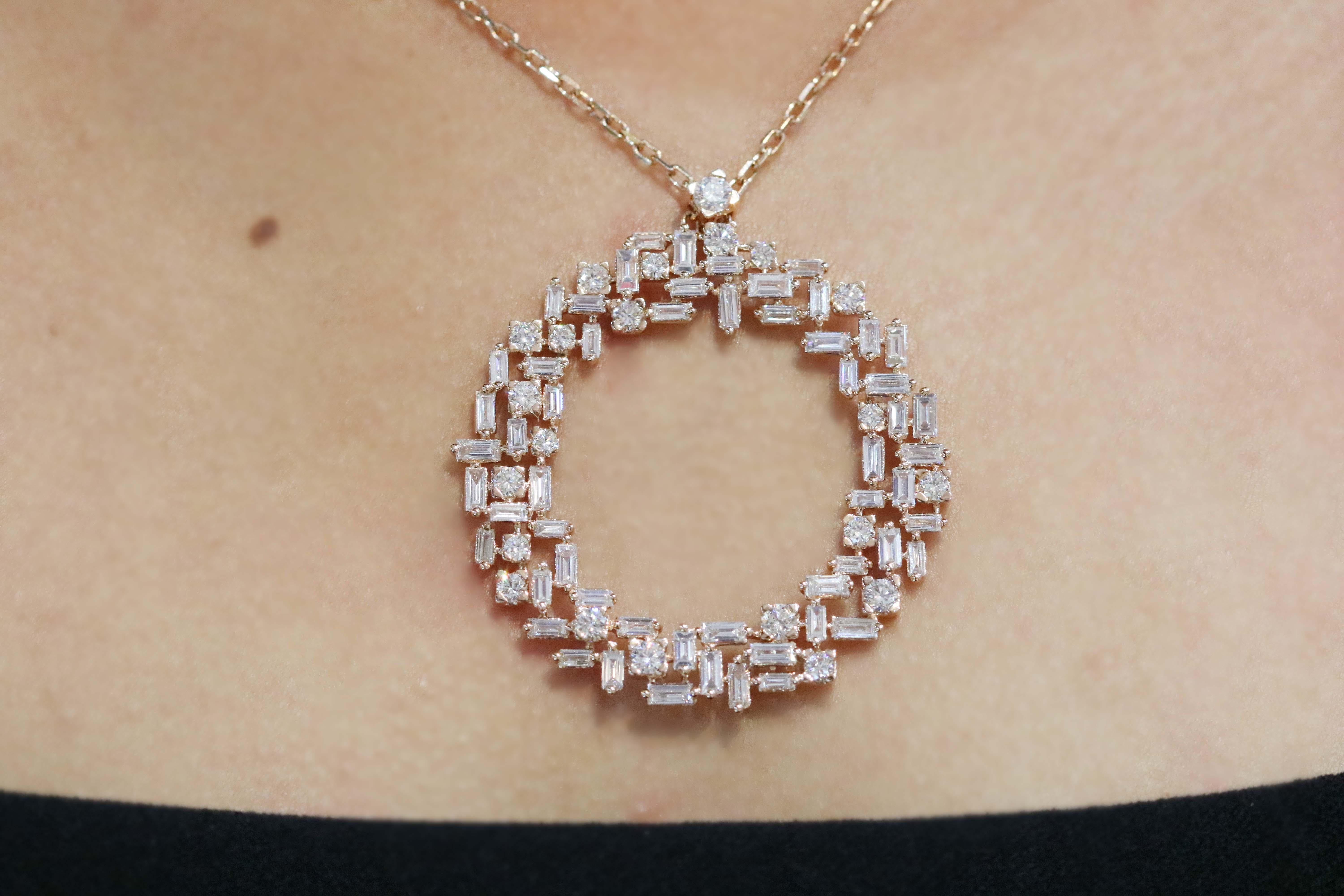 This rose gold pendant with baguette and round shape diamonds by Amwaj jewelry, as an illusion of a sparkling halo, is a perfect choice for casual, fashionable, but in the same time classy look. The round shape diamonds surrounded by the baguette