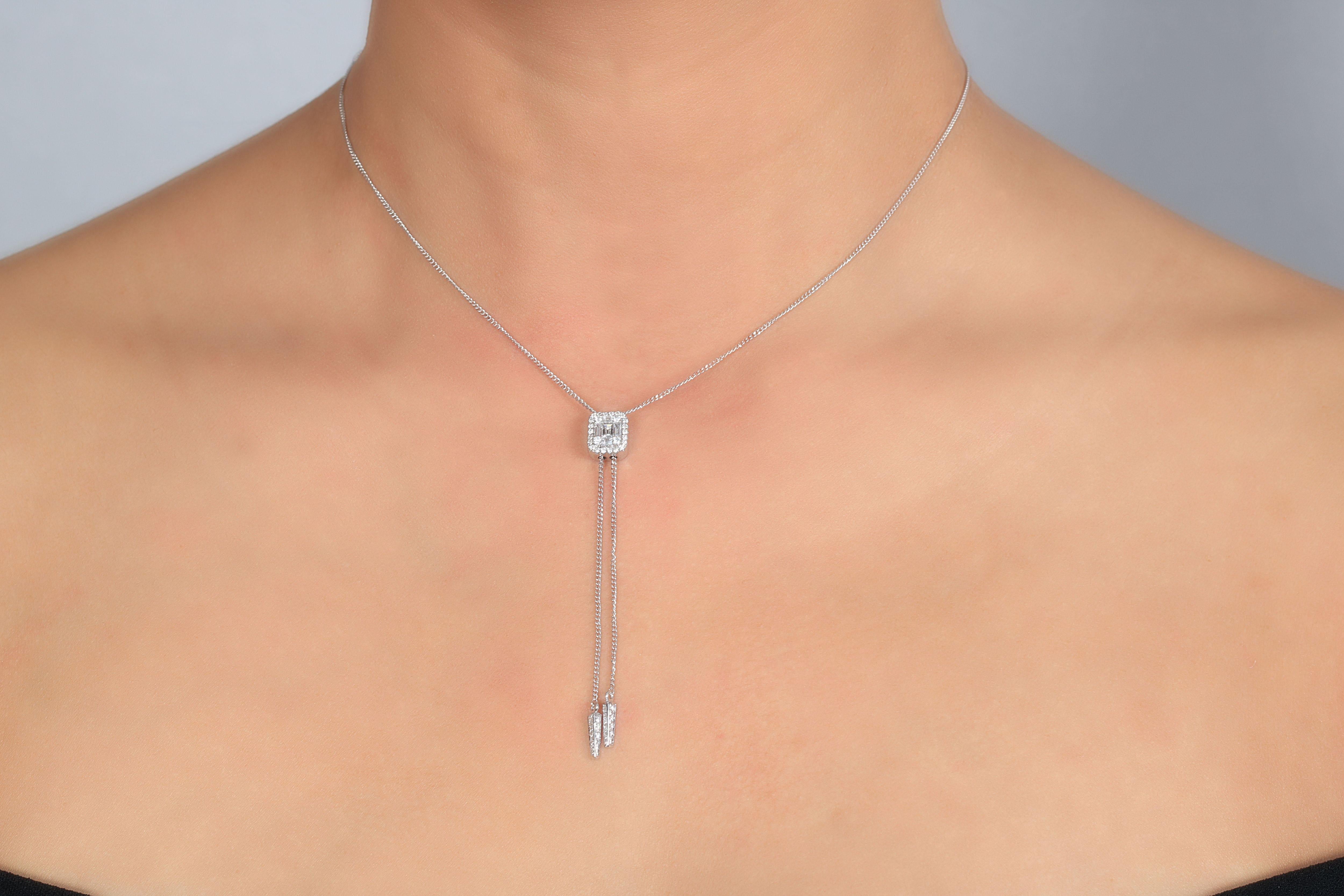 This white gold 18K necklace with baguette and round shape diamonds by Amwaj jewelry will add a delicate touch for a glamorous and feminine look of the lady who will choose this eternal piece. 
	
Diamond clarity: VS SI /G H color
Diamond weight: