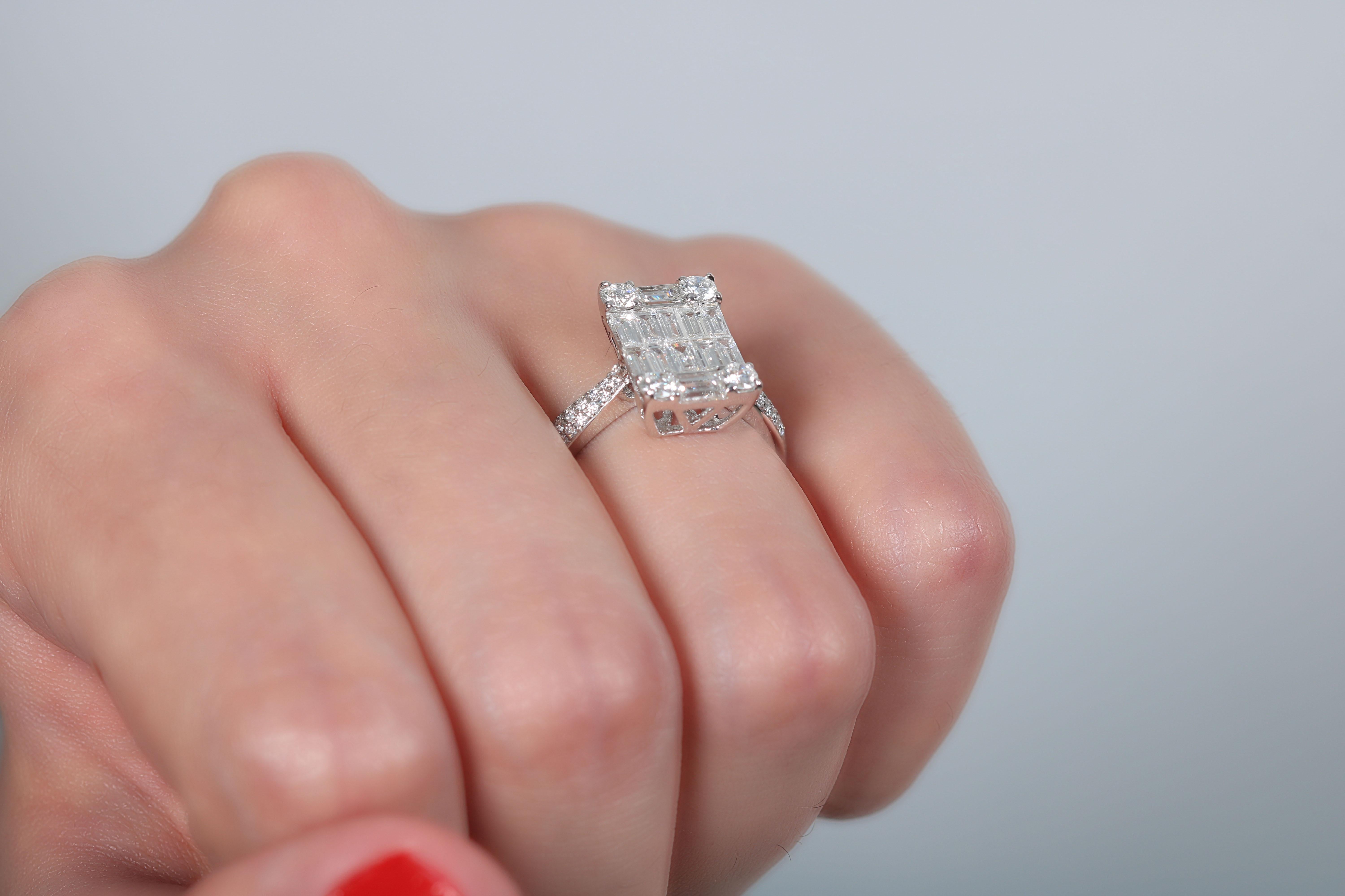 Exquisite decorative detailing makes this significant white gold 18 K ring with baguette and 4 round shape diamonds on the corners plus small micropave round diamonds on the side, a true standout. Complements well for the classiest occasions as well