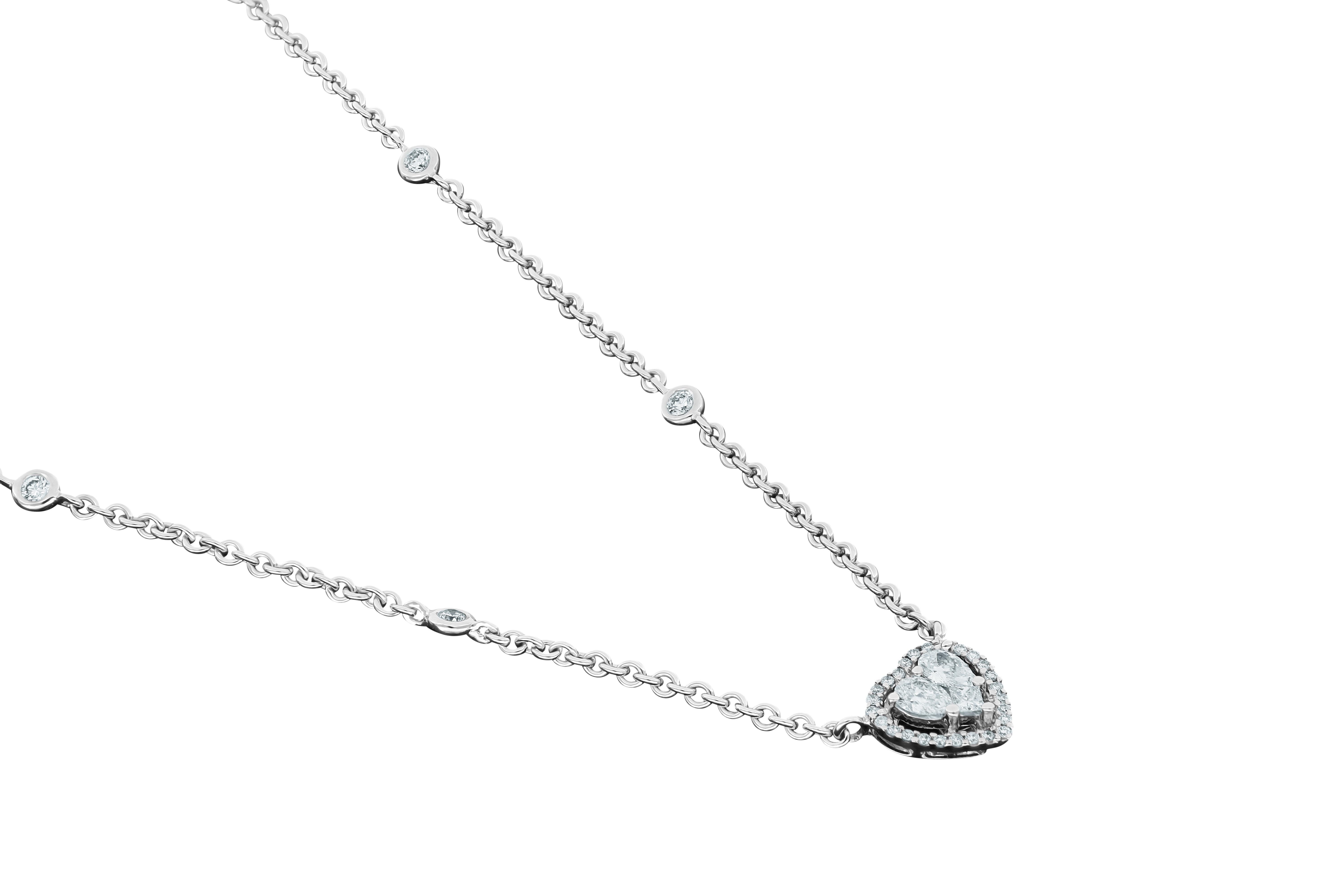 Unique, classy White Gold 18K Pendant by Amwaj Jewelry. Bring a touch of romance to your day to day style with this gorgeous Pendant made of two pear shape Diamonds and one princess cut Diamond framed with a beautiful round shape Diamond halo.