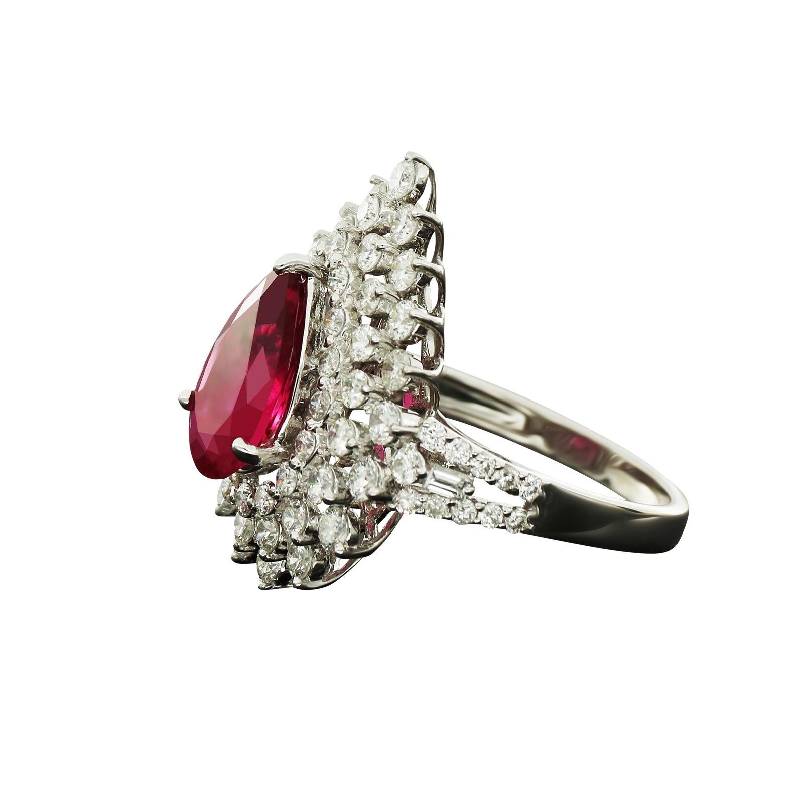 Gorgeous White Gold 18K Ring by Amwaj Jewelry with Ruby and round shape Diamonds. At the center there is a breathtaking ruby. Surrounding that are round shape Diamonds that are giving the appearance of petals. This amazing Ring is a perfect choice