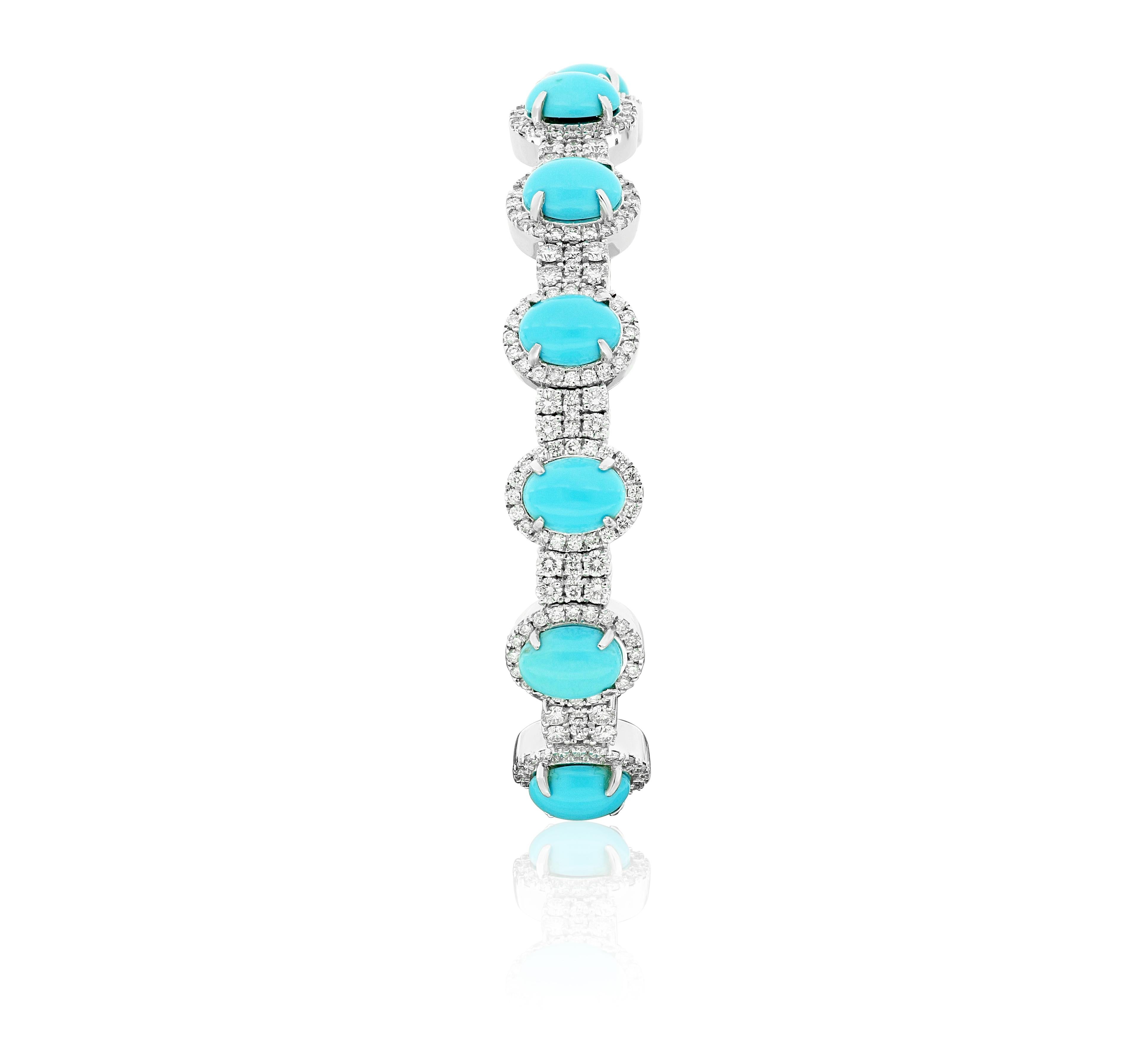 Amwaj eye-catching 18 karat white gold bangle showcases the flawless beauty of cabochon cut turquoise set in a minimal metal setting that let their powerful glow to show, separated by a combination of small round diamonds. 
18 Karat White Gold