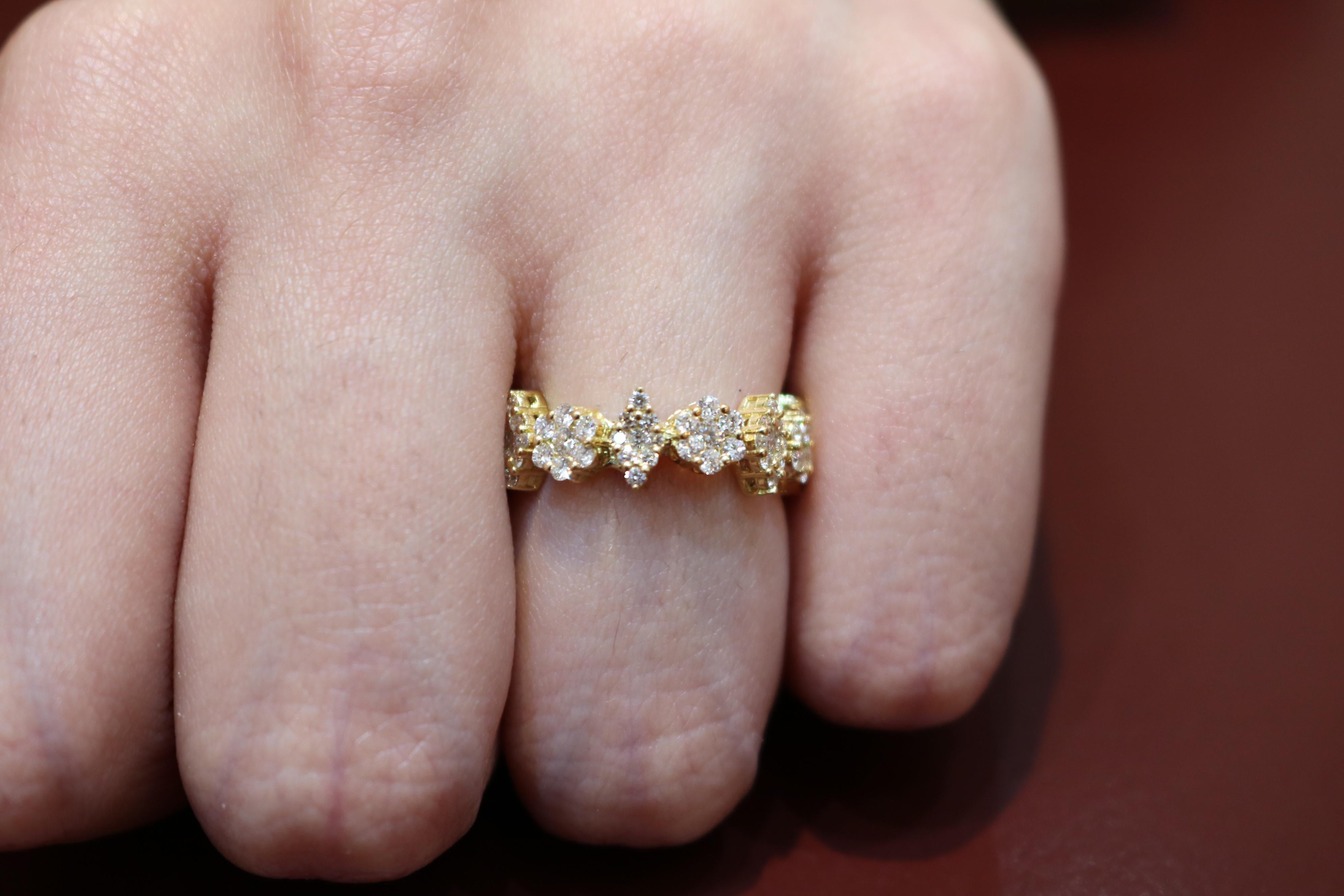 Stylish and modern 18K gold ring with round shape diamonds by Amwaj Jewellery. 
Making an illusion of Marquise and round solitaire, this artistic ring can be worn as a wedding band, but also as a part of special occasion outfit. 
Diamond clarity : 