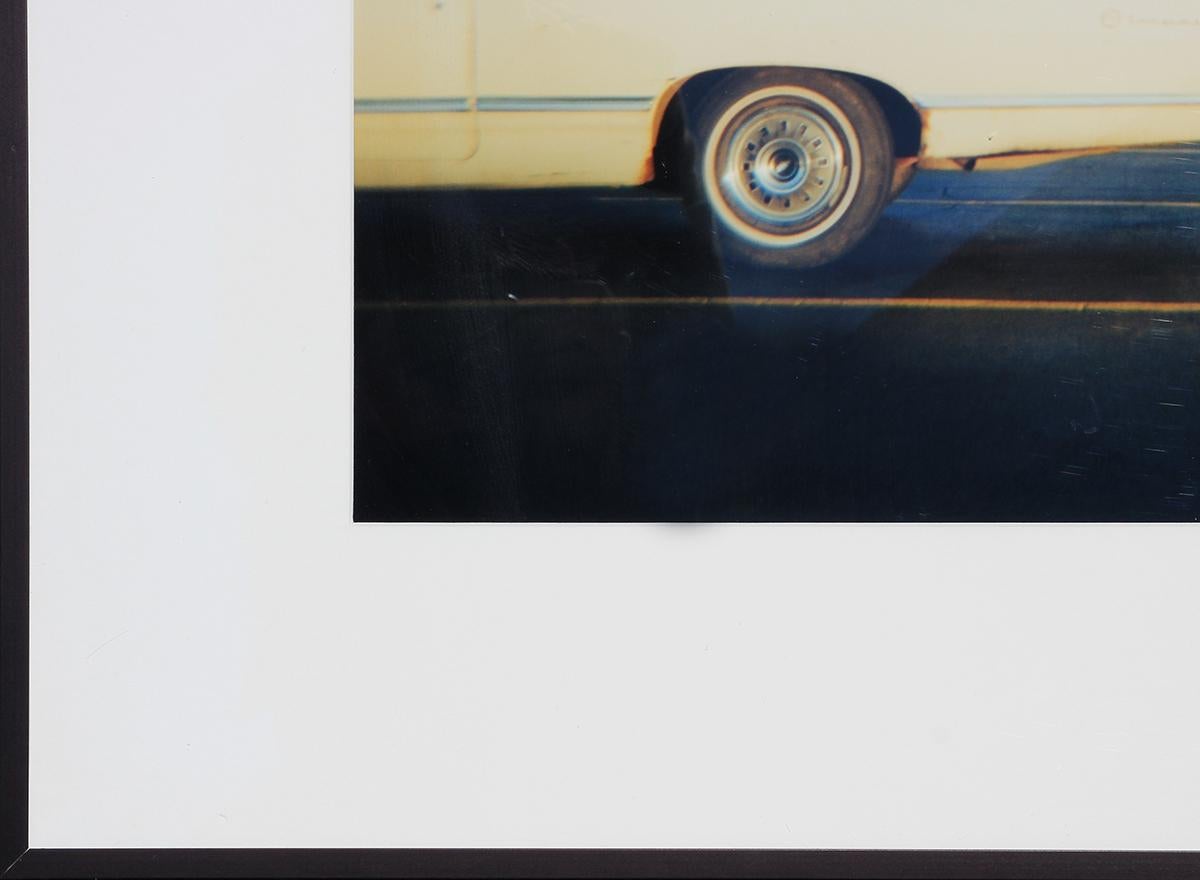 C-print photograph of a thrift store during the holiday season with a white vintage car parked out front by Houston, TX artist Amy Blakemore. The composition is expertly balanced between the car, building, and clear blue sky. Edition 1/20. Previous