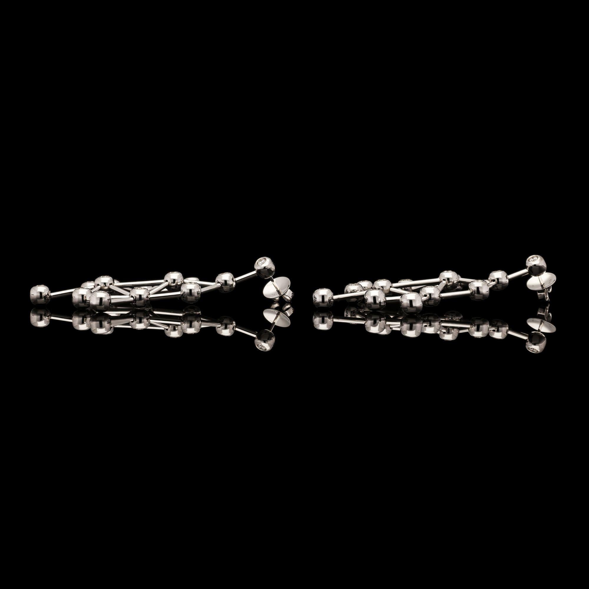 A stunning pair of diamond-set Covalent drop earrings by Amy Burton, the earrings of striking three dimensional geometric design each composed of thirteen spheres set with a round brilliant-cut diamond and linked by finely articulated narrow bars,