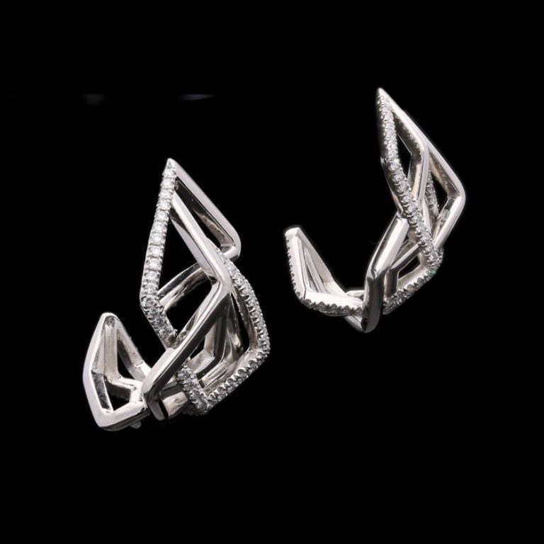 A beautiful pair of sculptural asymmetric platinum and diamond Disorient hoop earrings.

Amy Burton, Contemporary

London

Setting Platinum with makers mark and London assay marks

Gemstones and Other Materials Round brilliant diamonds weighing a