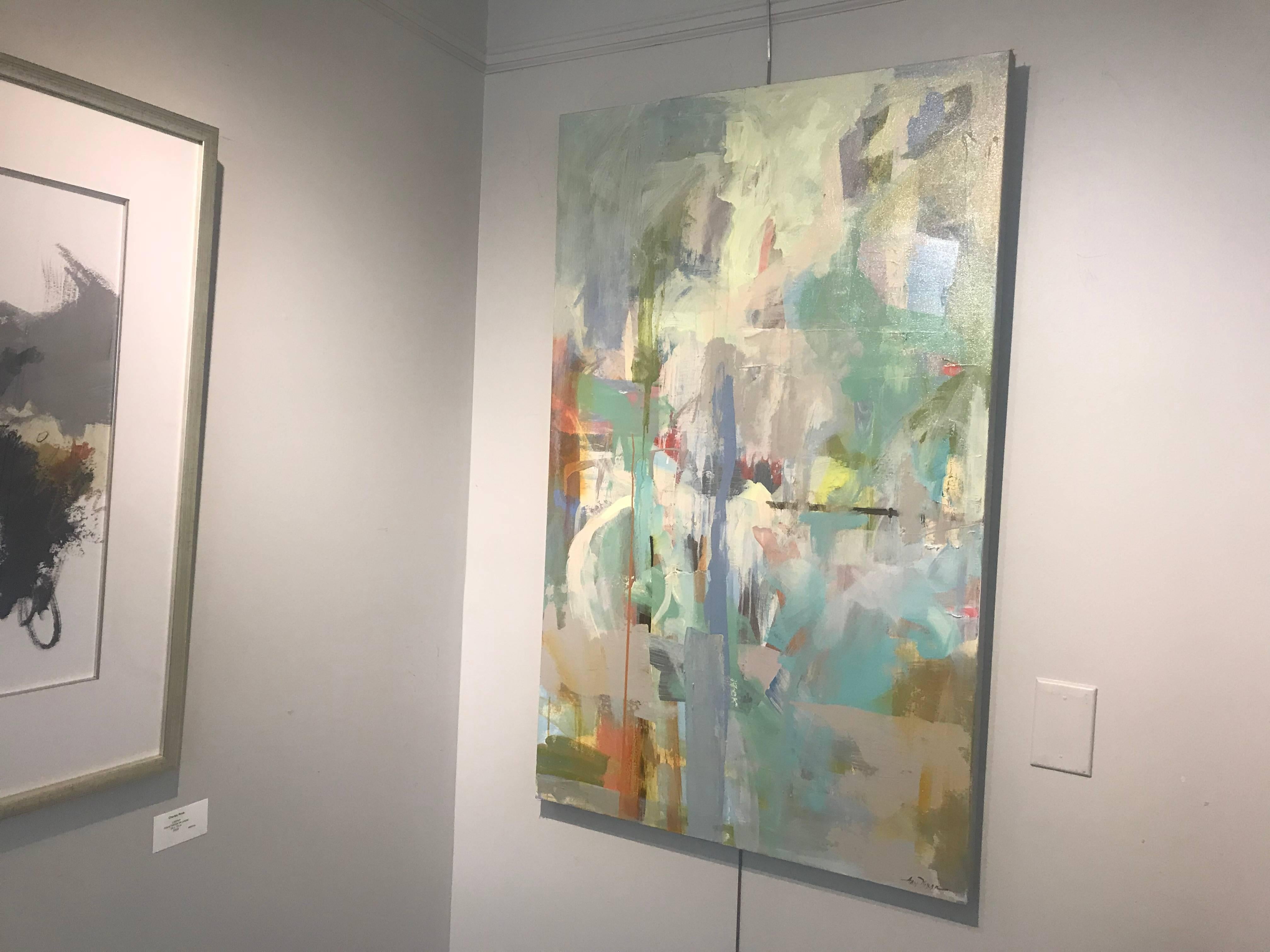 'Mindful I' is an abstract acrylic and ink on canvas painting created in 2018 by American artist Amy Dixon. Featuring a vertical format, this painting showcases a palette made of a variety of colors that include greens, turquoises and burnt orange.