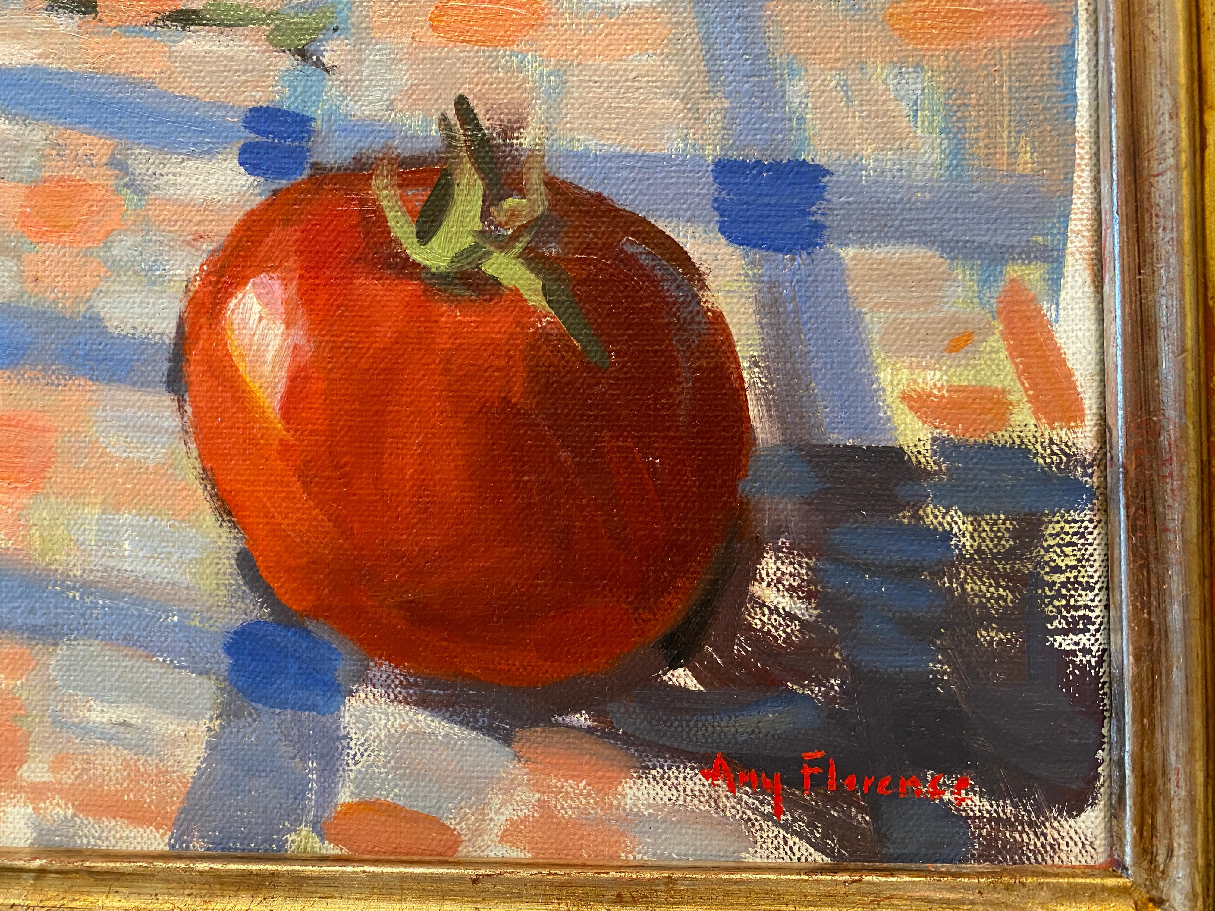 Une peinture à l'huile de tomates rouges brillantes sur une nappe à carreaux. Cette œuvre reflète la conviction de l'artiste que les choses ordinaires possèdent une grande beauté.  Après une matinée passée à cueillir des tomates dans le jardin de