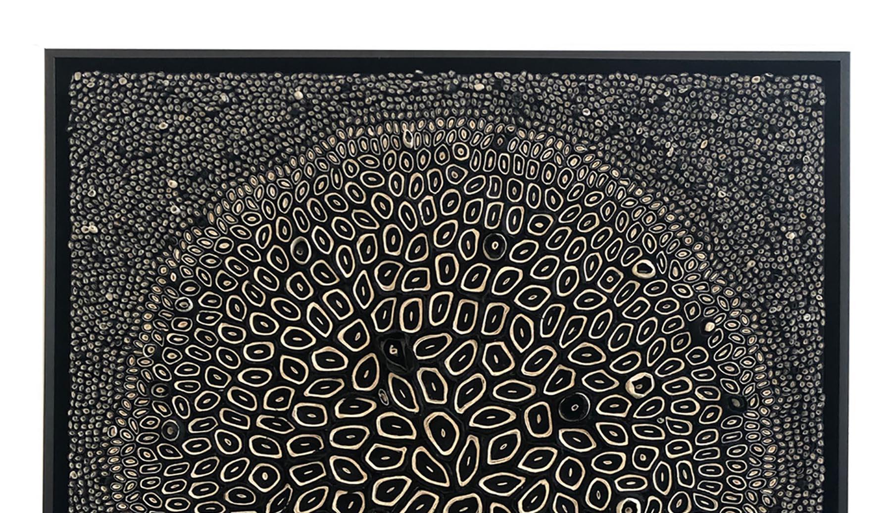 
These black and white dimensional paper pieces are by mixed media artist, Amy Genser. These textural, one-of-a-kind framed wall works embody movement and processes. She masterfully manipulates paper -- each piece being cut, rolled and stacked -- to