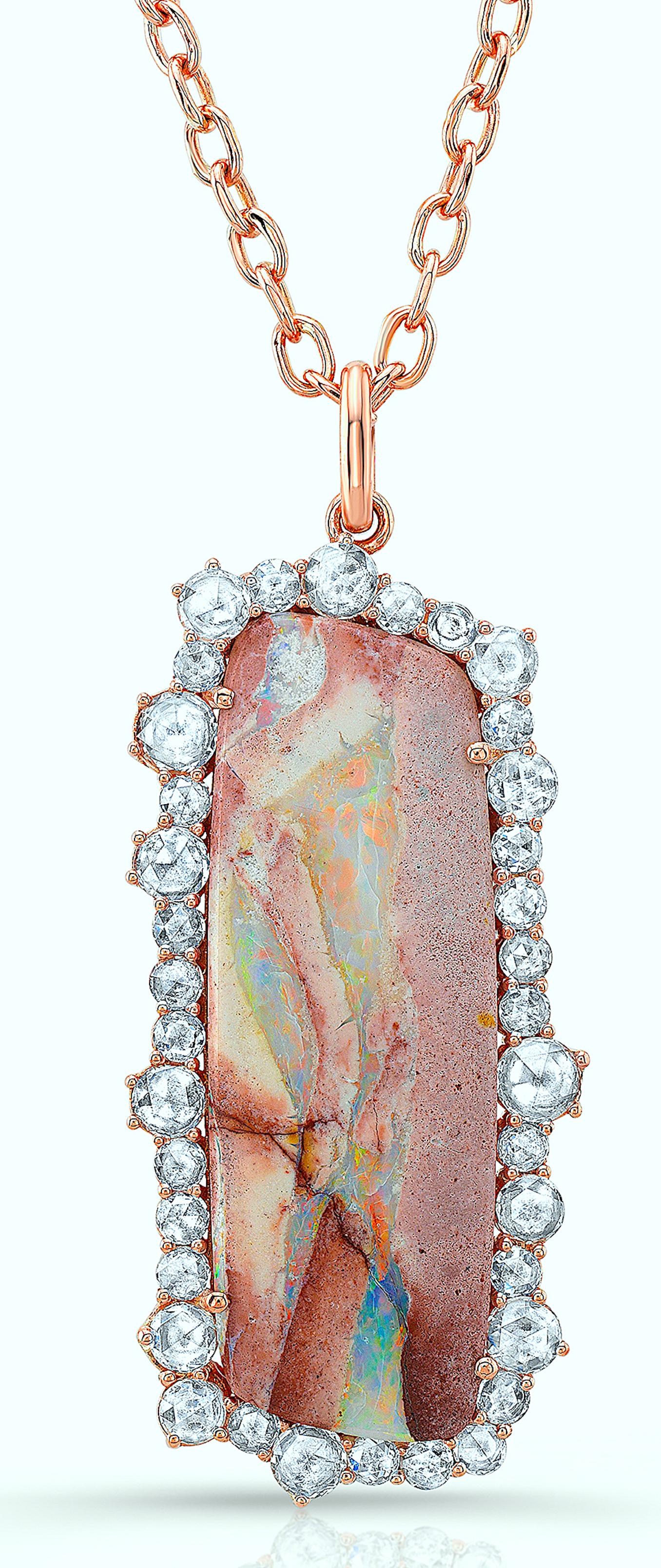 Amy Y's boulder opal and diamond contemporary pendant necklace is a one-of-a-kind piece for all occasions.  This primarily blue, hints of pink-colored boulder opal rest superbly in 18K-rose gold, impeccably surrounded by a single row of beautiful