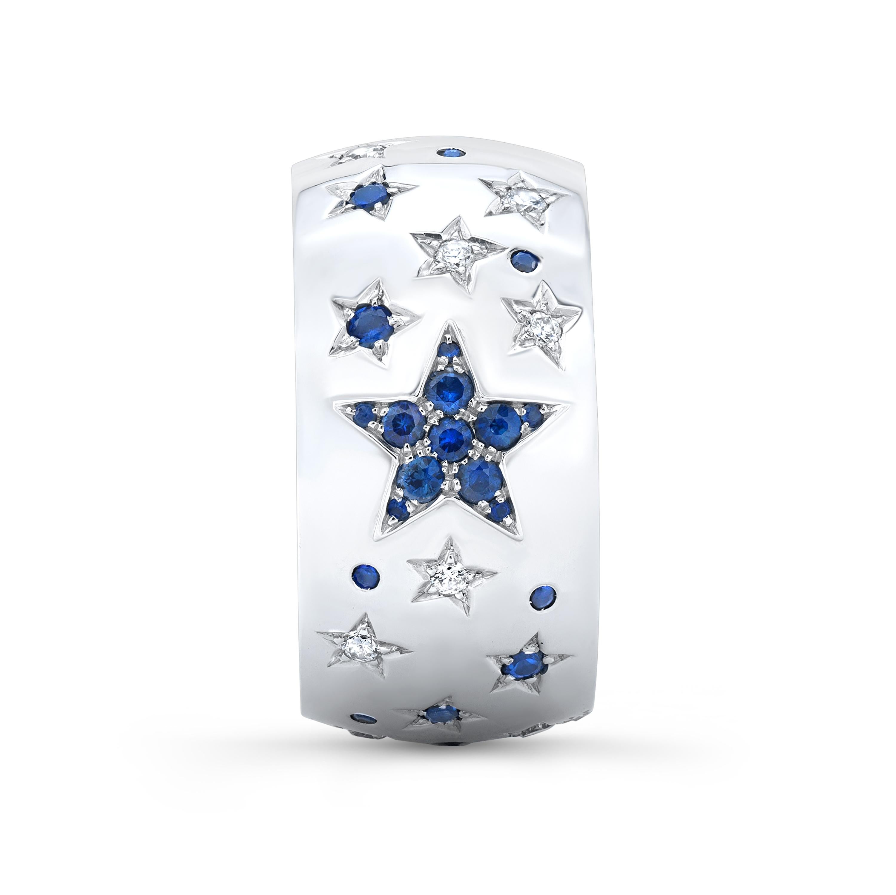 Amy’s contemporary diamond and sapphire sun, moon and stars ring Celeste is a universe illuminated with bright stars, sprinkled with sapphires throughout and a warm sun and sparkly crescent moon. Handmade in 18K-white gold and diamond inlay of