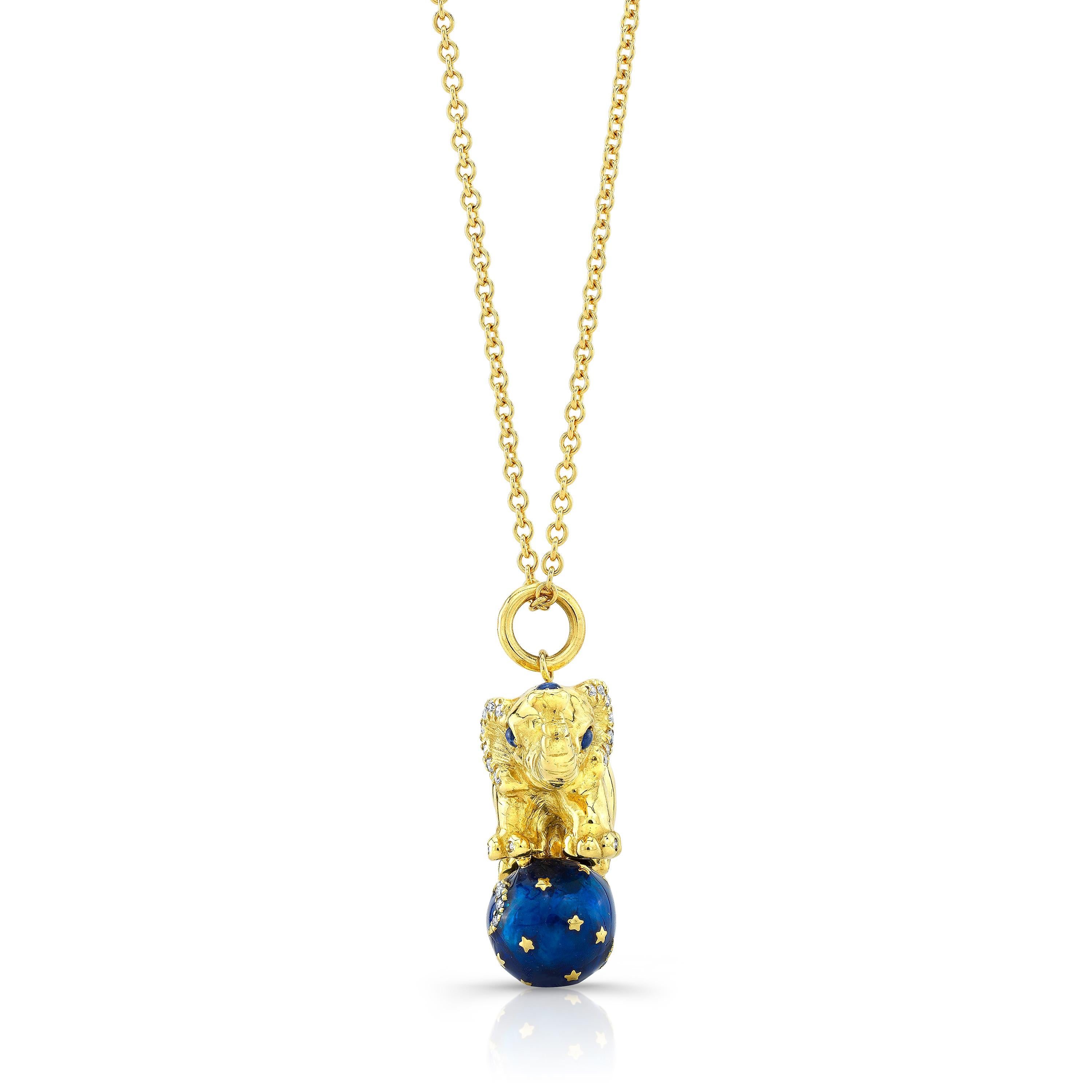Amy Y’s Contemporary 18K-yellow gold, diamond, sapphire and enamel elephant pendant necklace Tuffi is a one-of-a-kind gem. Full of character is this charming elephant is balanced on a dazzling hand-painted midnight blue enamel ball with a diamond