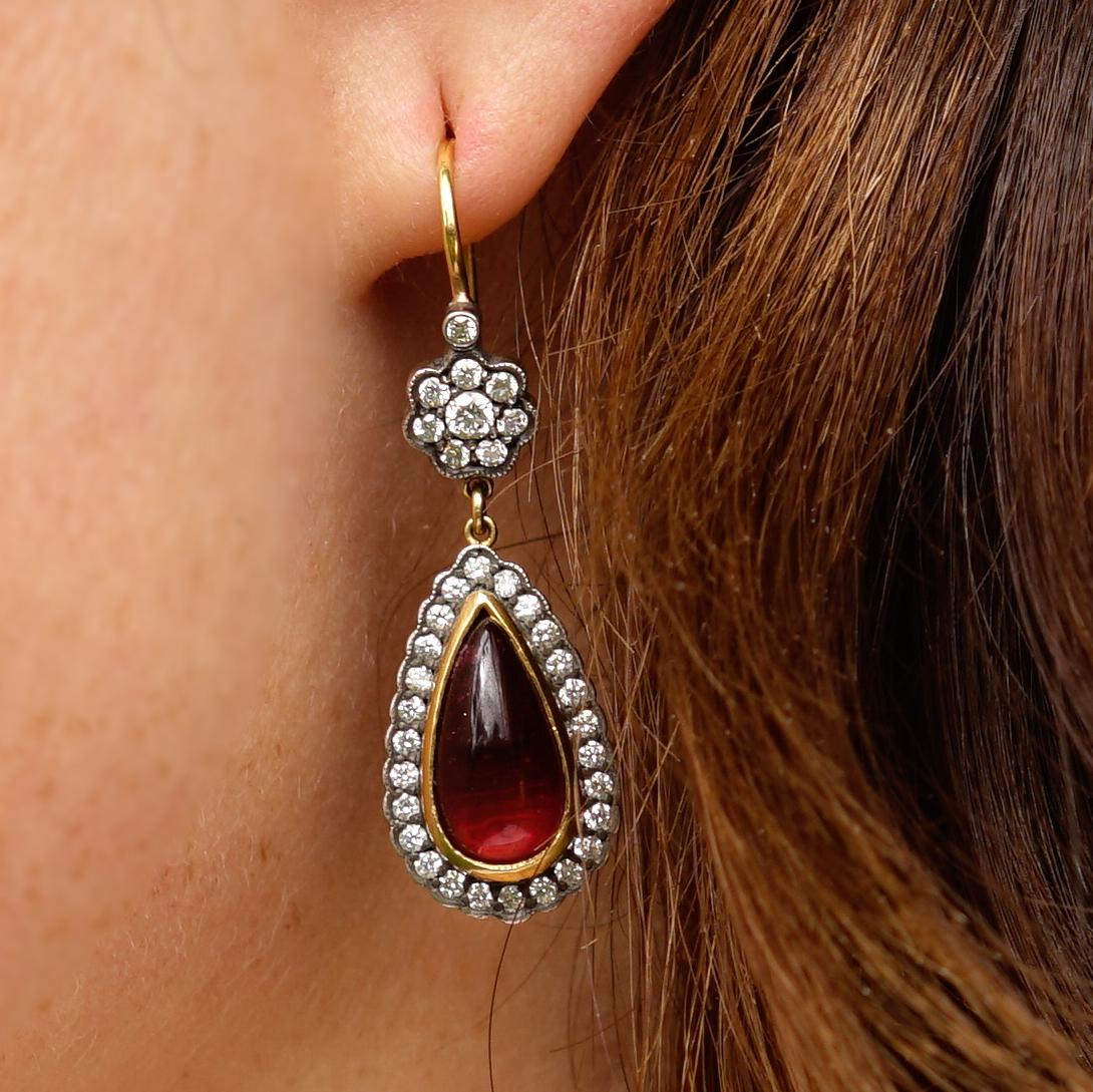 Amy Y’s teardrop flower design in 18K-yellow gold, pink tourmaline and diamond earrings echoes nostalgia reminiscent of the Victorian era. Beauty beyond is this contemporary one-of-a-kind earring handmade by Amy’s esteemed European artisans.