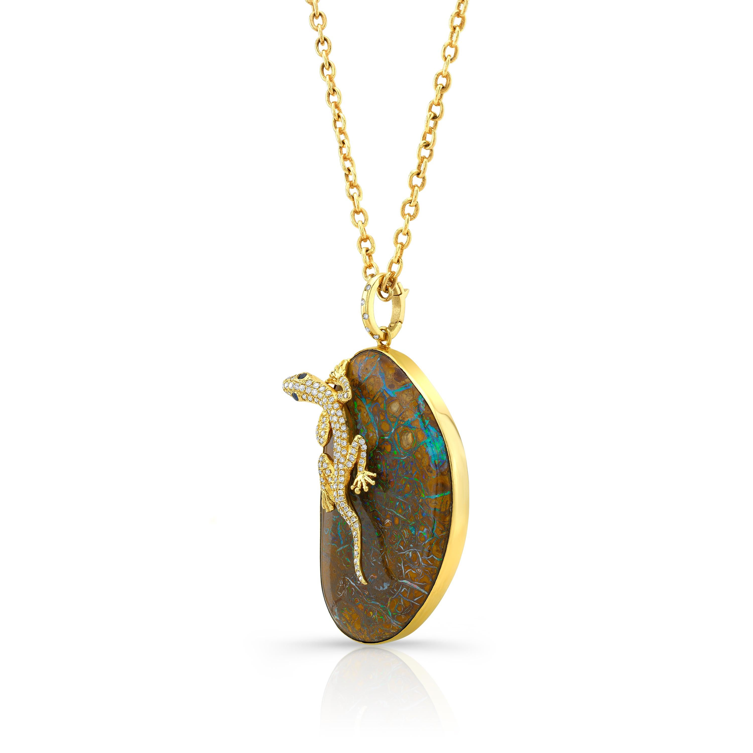Amy Y’s 18K gold, opal, diamond and sapphire pendant necklace embraces the earth’s desert friends in this one-of-a-kind whimsical gecko Rex.  Colors of the rainbow light up this Australian boulder opal, gold and diamond detailed gecko.  Handmade by