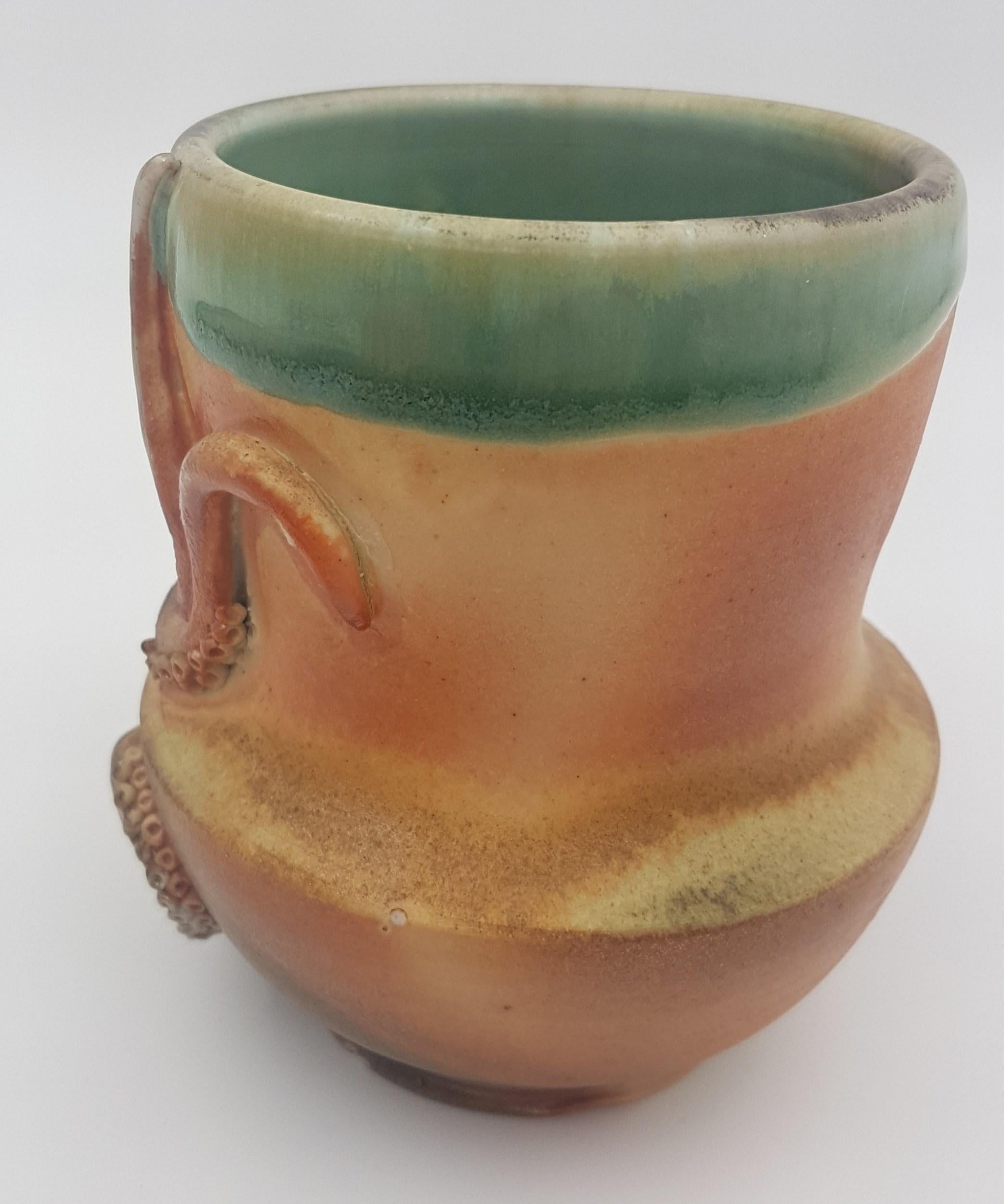Title : Octomug
Materials : Wood Fired Porcelain
Date : 2016
Dimensions : 4.5″x3.25″x5.25″
Description : Wood fired Octomug
Signed
Galllery COA provided

------------------------

Amy Young Artist Statement:

