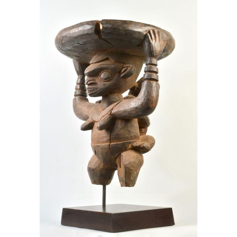 Babanki Maternity stool in wood

Wood-carved caryatid maternity stool depicting a mother, baby and basket from the Western Cameroon Grasslands. Ex Sidney and Gae Berman collection, New York. Acquired before 1974

Additional Information
Ethnic